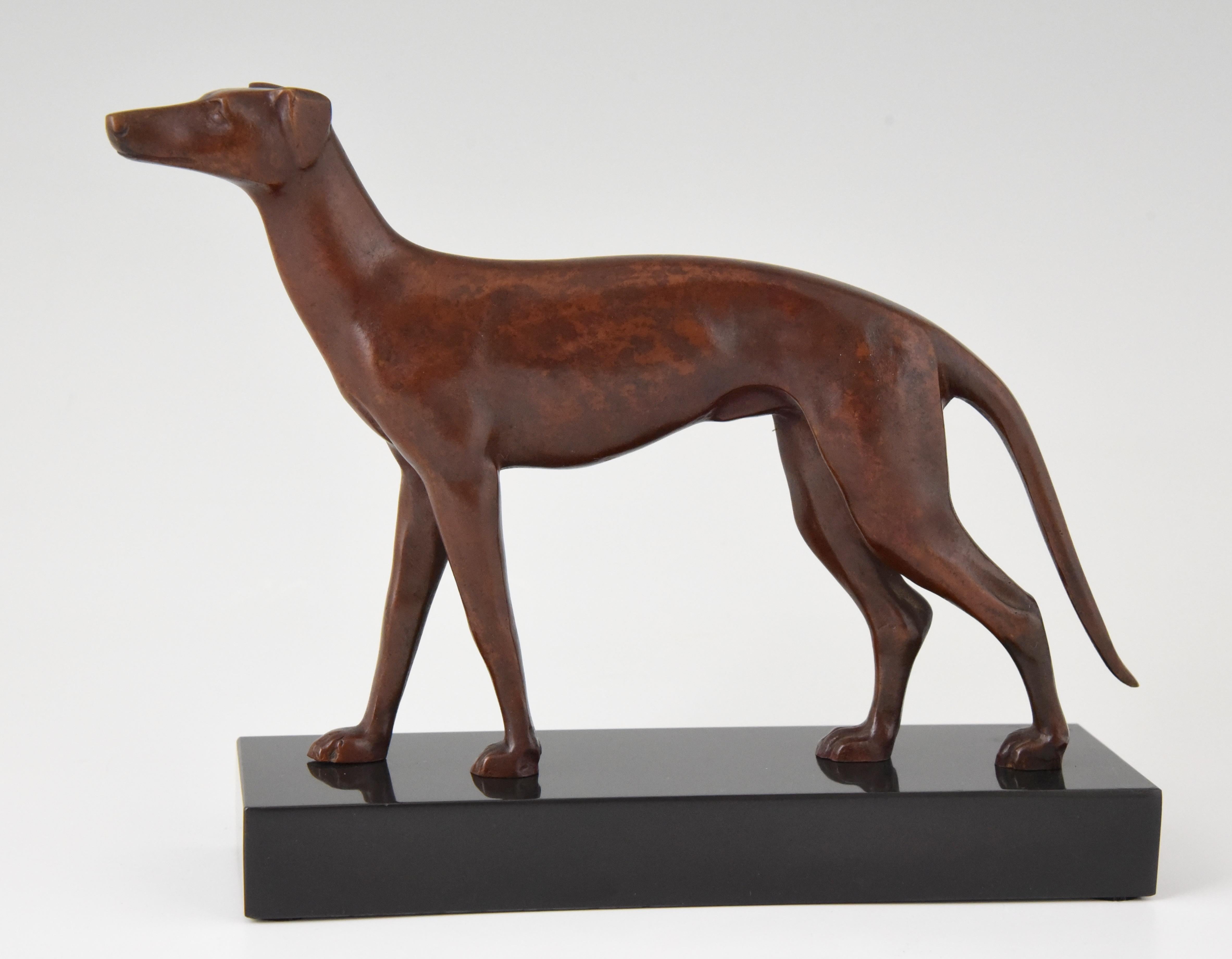 Elegant Art Deco bronze sculpture of a greyhound dog. The bronze is signed by the French artist Jean Luc and stands on a Belgian black marble base, circa 1930.