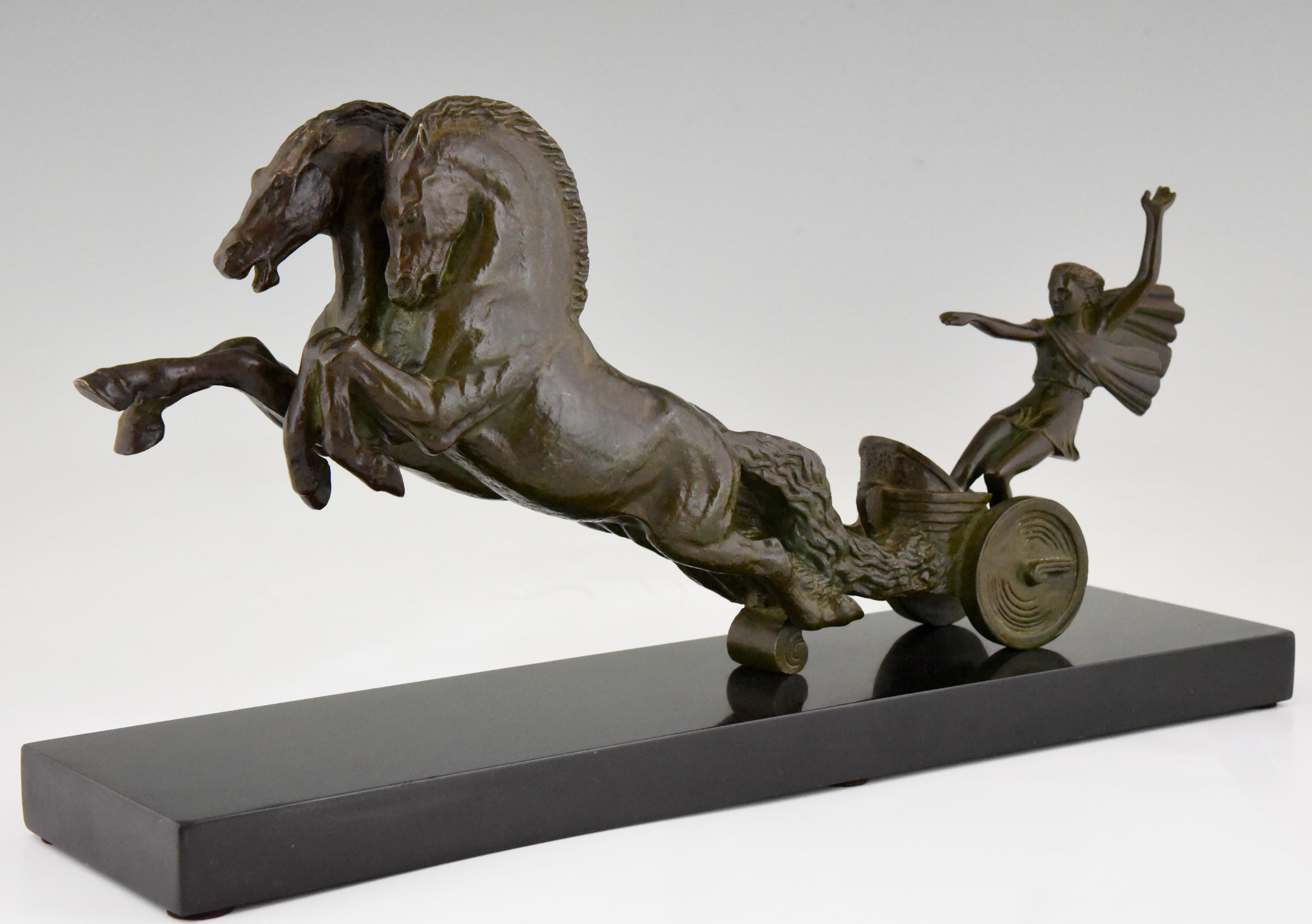 Beautiful Art Deco bronze sculpture of a young girl in a chariot with two rearing horses signed by the French artist Ruchot. Lovely green patina, mounted on a Belgian black marble base, circa 1930.
 