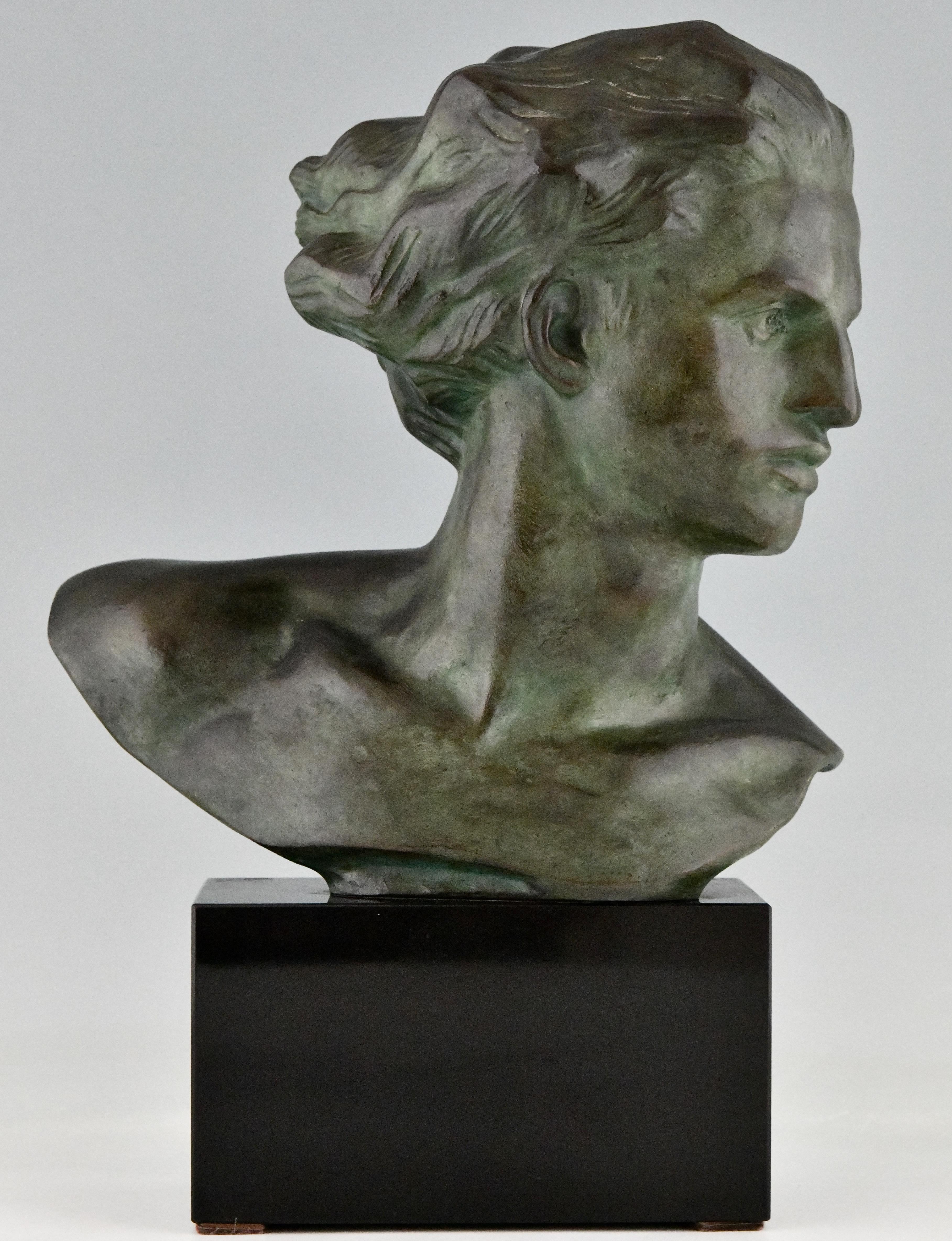 Art Deco bronze sculpture, male bust of the aviator Jean Mermoz. 
By the artist Georges Gori. The bronze statue has a green patina and is mounted on a Belgian Black marble base. France 1930.
Literature:
Benezit. Statuettes of the Art Deco period.