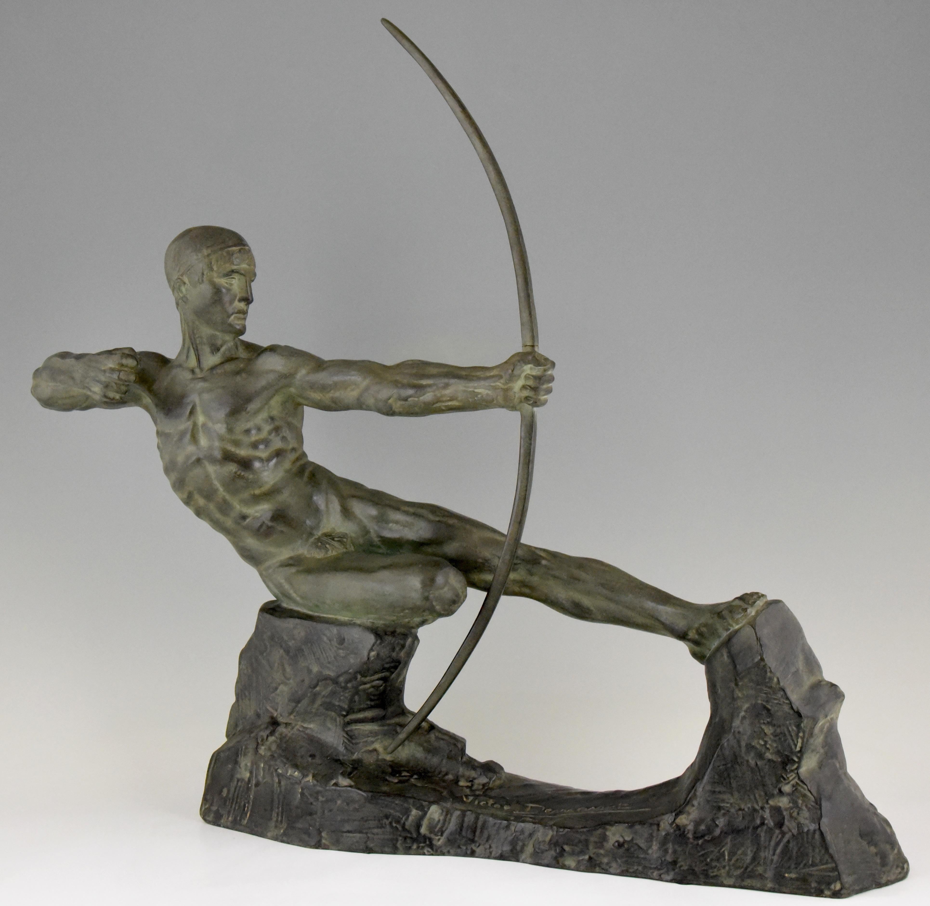 Beautiful Art Deco bronze sculpture of a male nude with bow. The title of this work is Hercules. Signed by Victor Demanet, a famous French artist. The bronze has a lovely green patina, circa 1925. 

Illustrated in
“Beeldhouwkunst in België” by