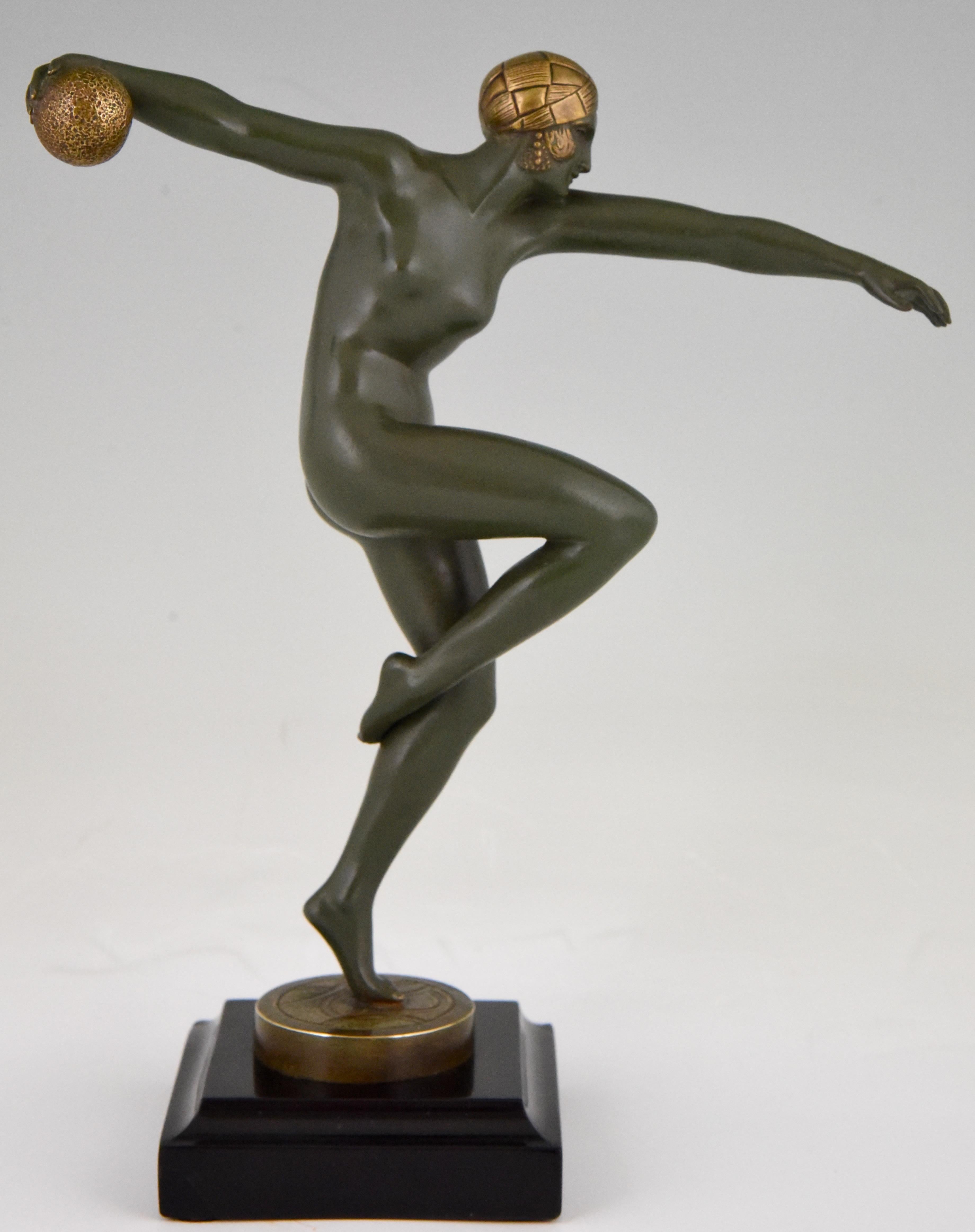 Art Deco bronze sculpture of a nude dancer with ball signed by Maurice Guiraud-Rivière. Patinated bronze on a Belgian black marble base, France, 1920.

This sculpture is illustrated in the 3 following books:
“Art Deco and other figures” by Brian