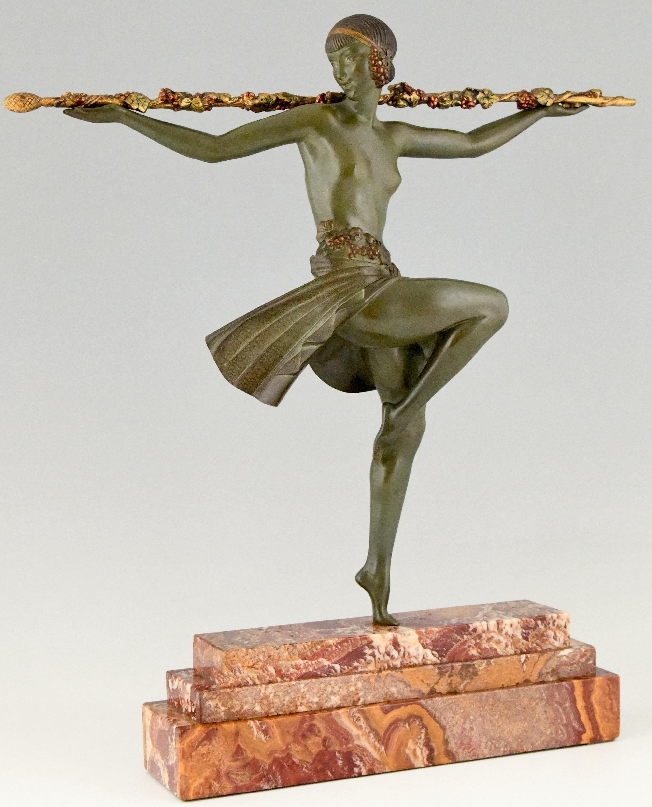 Tall and elegant Art Deco bronze sculpture of a semi nude female dancer with Thyrsus. This bronze has a beautiful patina. The sculpture is mounted on a stepped marble base. France 1930.

This bronze is illustrated in the following books:? “Art