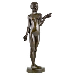 Escultura Art Decó de bronce chica desnuda con paloma de Henry Arnold Francia 1928.