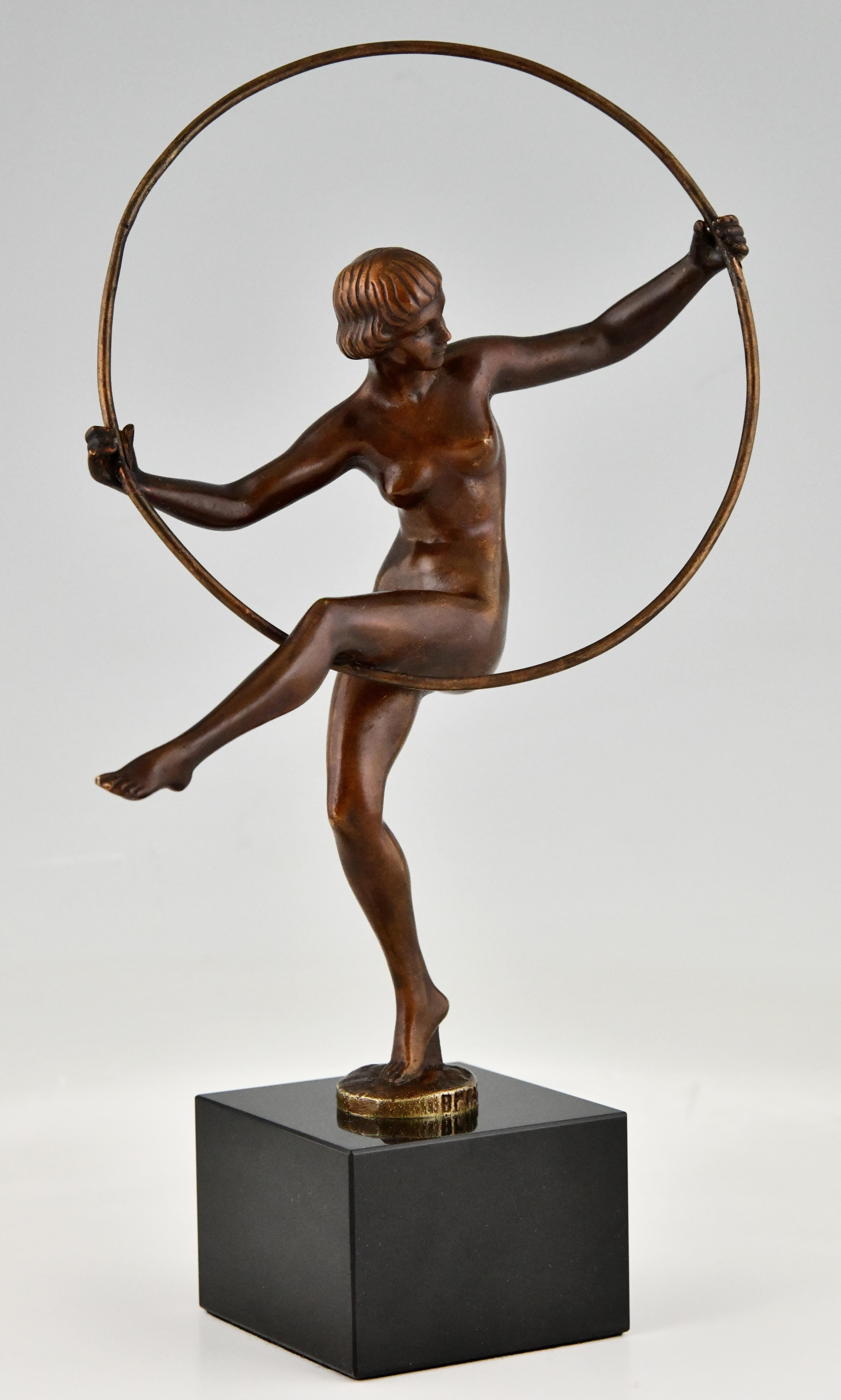 Art Deco bronze sculpture nude hoop dancer signed by Briand, the pseudonym of Marcel Bouraine. Bronze with brown patina on Belgian Black marble base. France 1930.