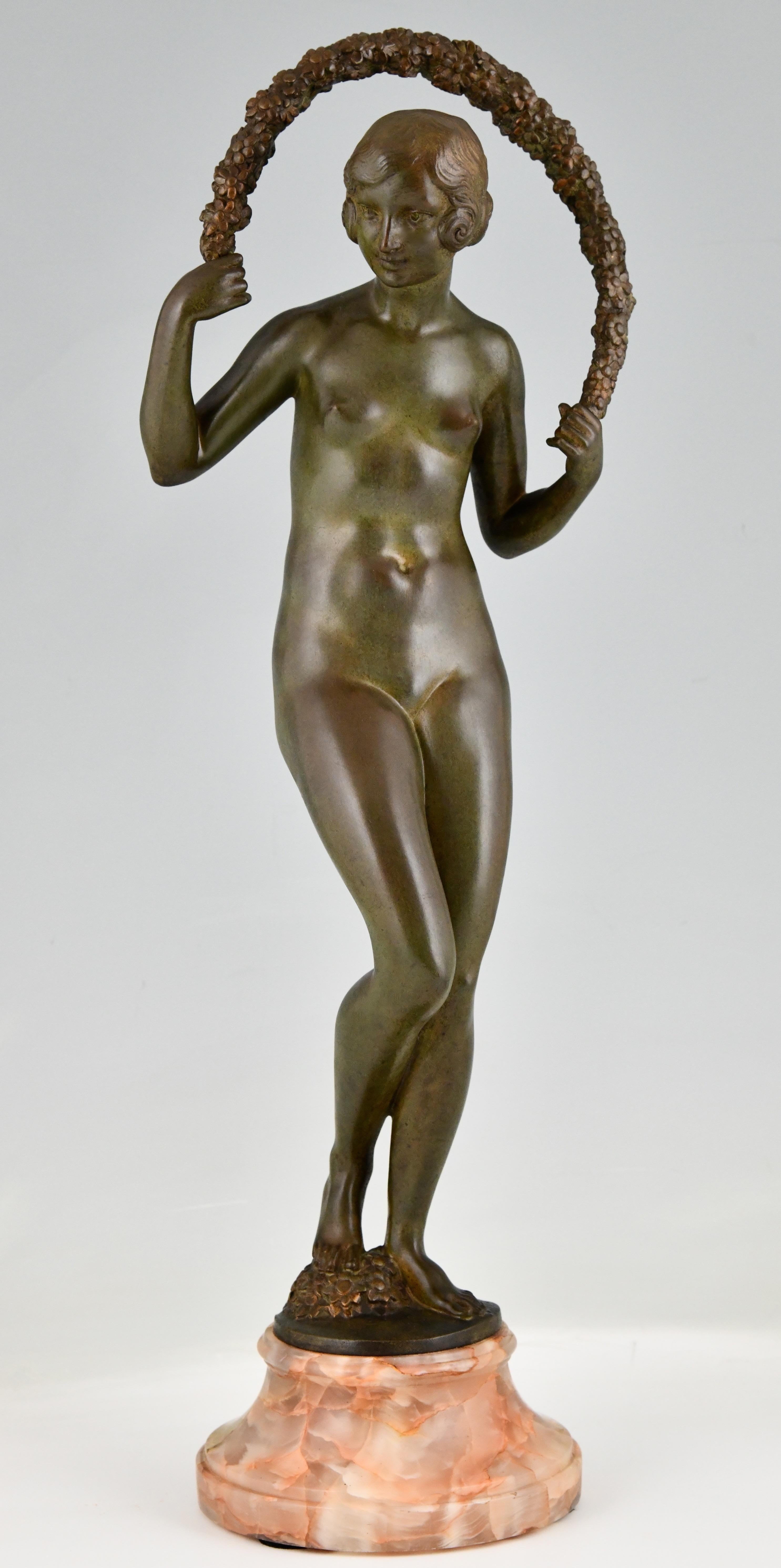 Art Deco bronze sculpture nude with garland by Joe Descomps Cormier.
Patinated bronze on marble base. France 1925. 
This bronze is illustrated in 
Art Deco and other figures, Brian Catley, Antique collectors club, 
Statuettes of the Art Deco