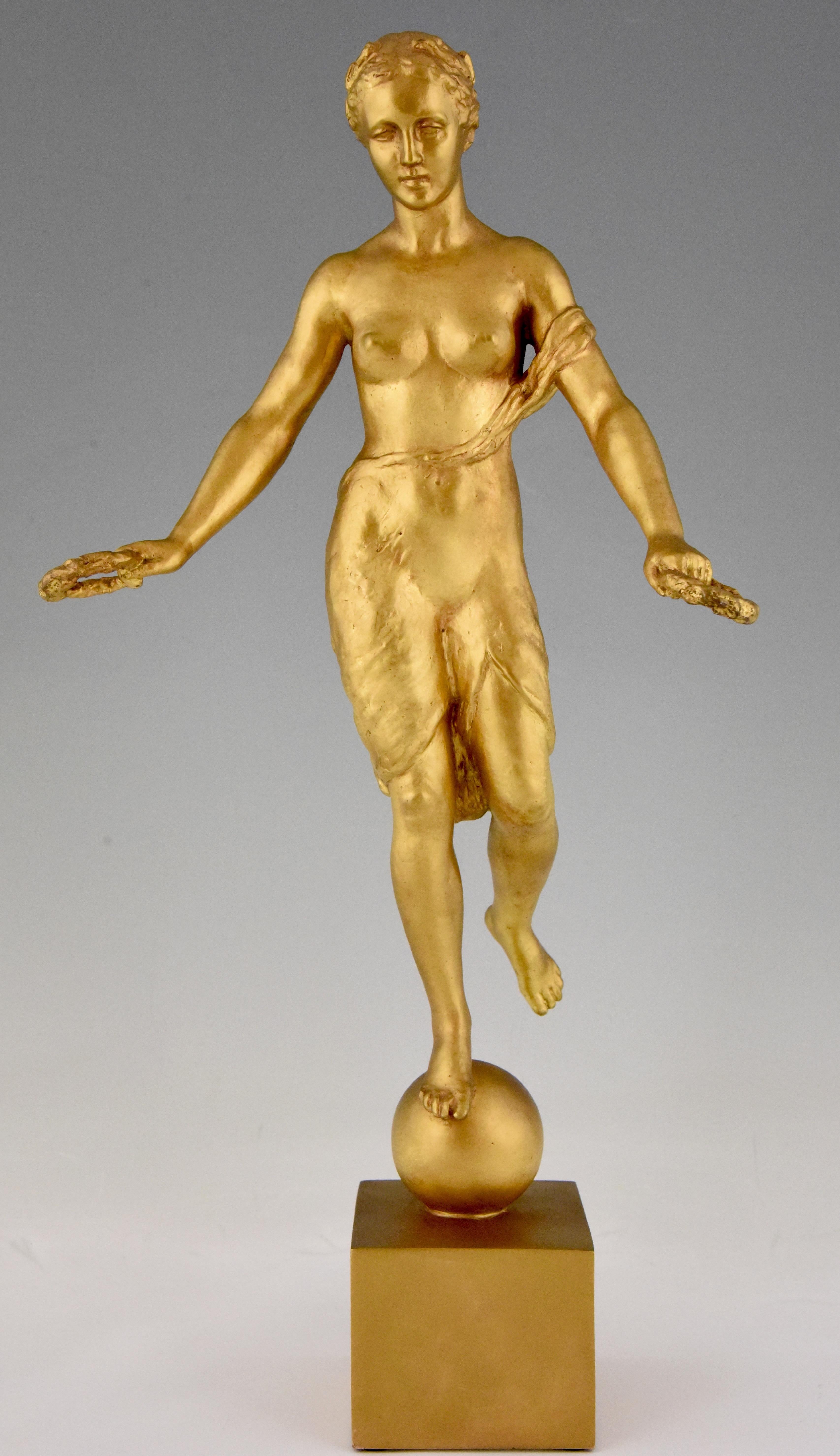 Art Deco sculpture of a semi nude balancing on a ball holding 2 laurel wreaths signed Hann Cauer with founders' signature H. Noack Berlin. Germany, dated 1934.
Literature: 
“Dictionnaire des peintres, sculpteurs, dessinateurs et graveurs” by E.