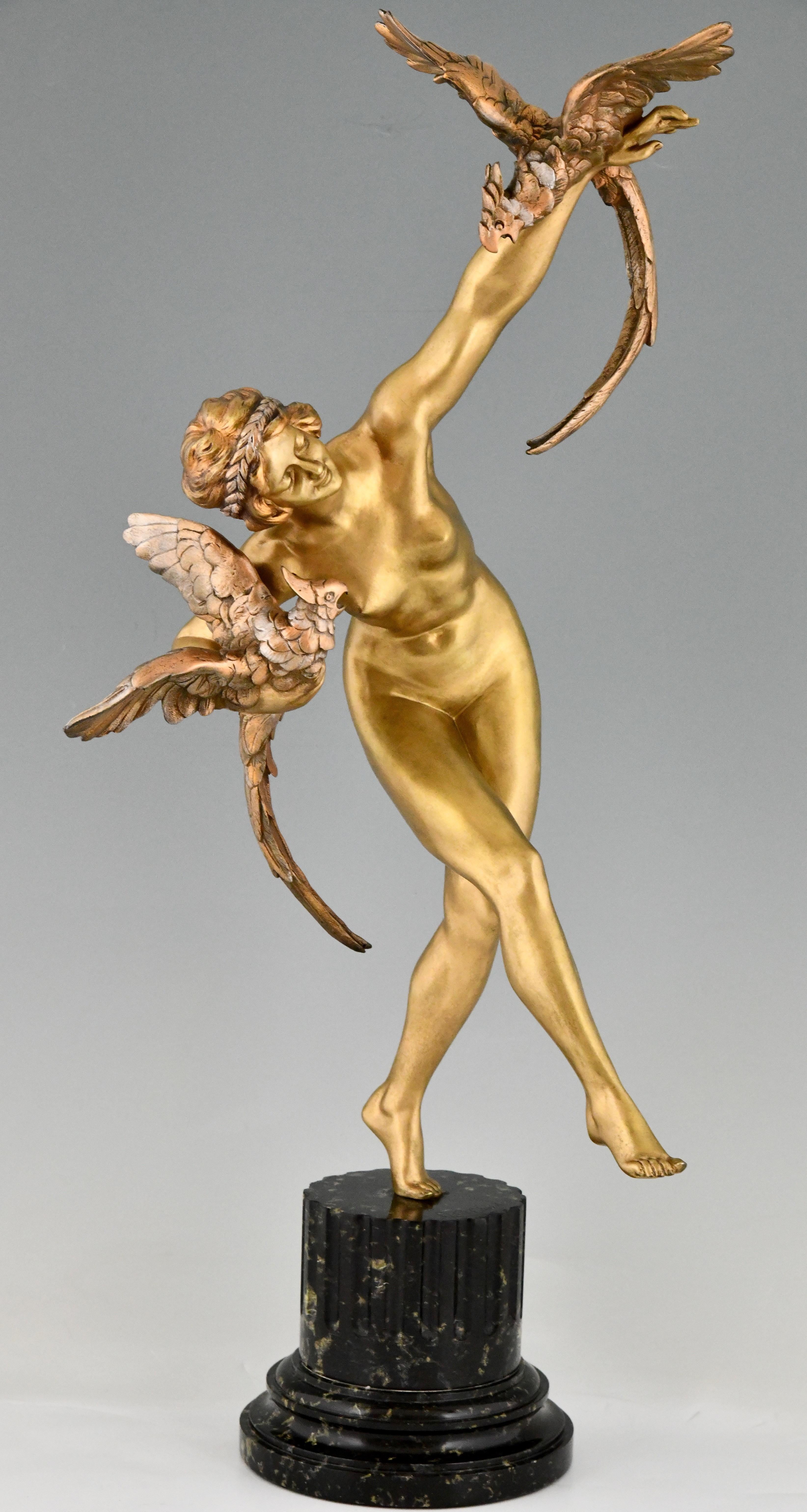 Art Deco bronze sculpture nude with parrots by Claire Jeanne Roberte Colinet. 
The bronze has a multicolor gilt patina and stands on marble base, France ca. 1925. 
Impressive size 76 cm. or 30 inch. 
The work is illustrated in two books:
Art