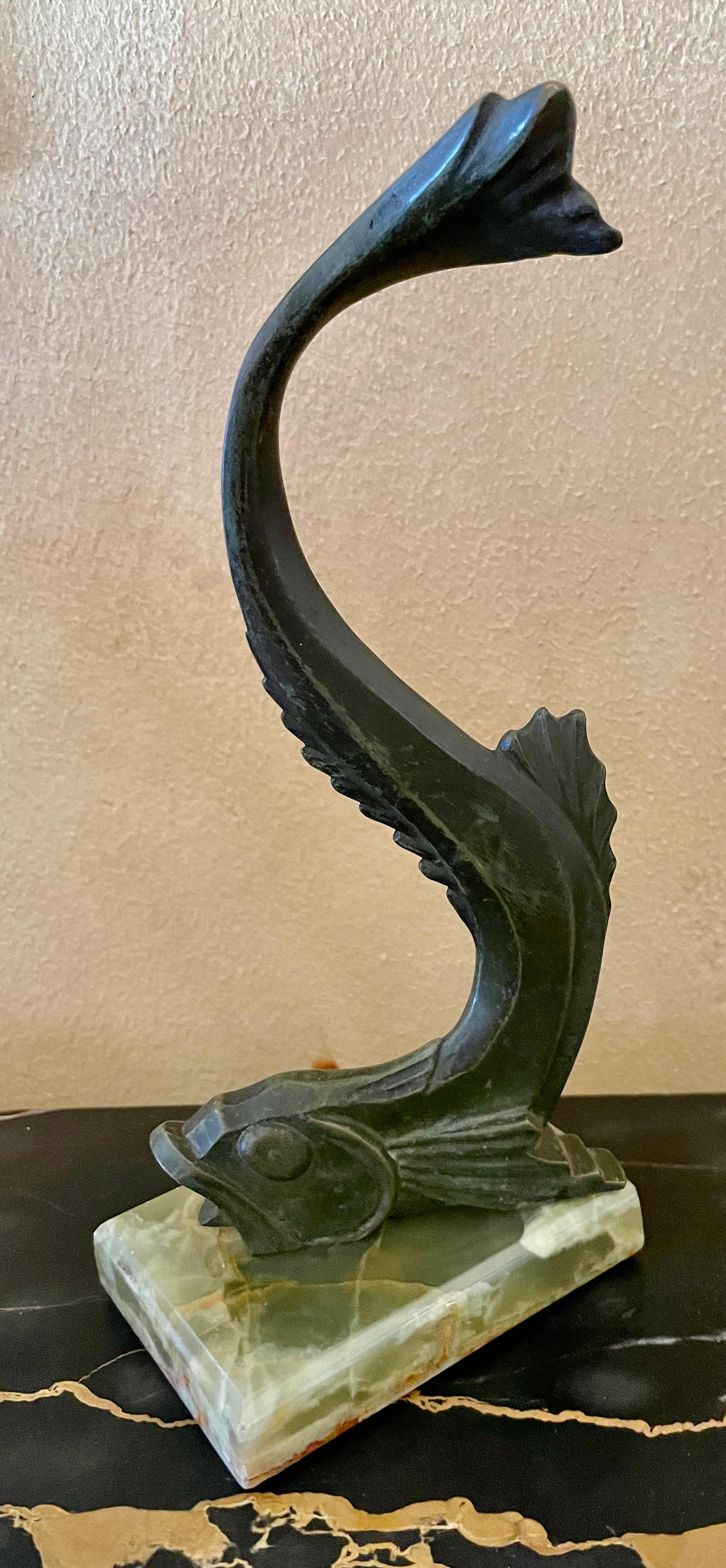 Bronze cubist fish figurine, circa 1920, finished in original verdigris patinated bronze. Signed on the sides of both edges edge, E.M. Sandoz also with “S. Freres” signature as well and mounted on a green marble base. Sandoz with his deep body of