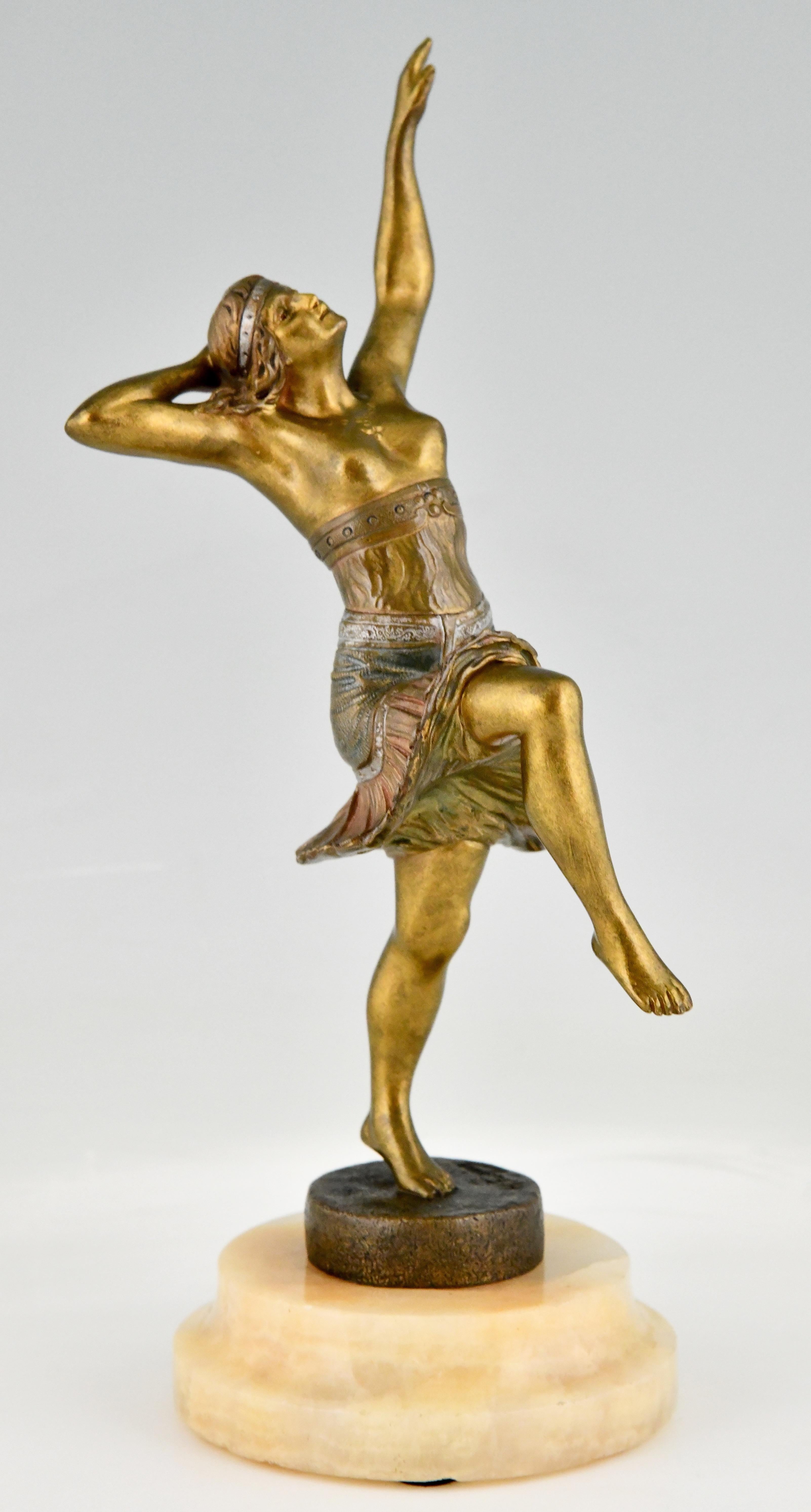 Art Deco bronze sculpture of a dancer signed by Henry Fugère. 
Bronze sculpture of a semi nude dancer in Orientalist dress with multi color patina on a onyx base. 
France 1925.

Literature: 
Art Deco and other figures by Brian Catley
Antique