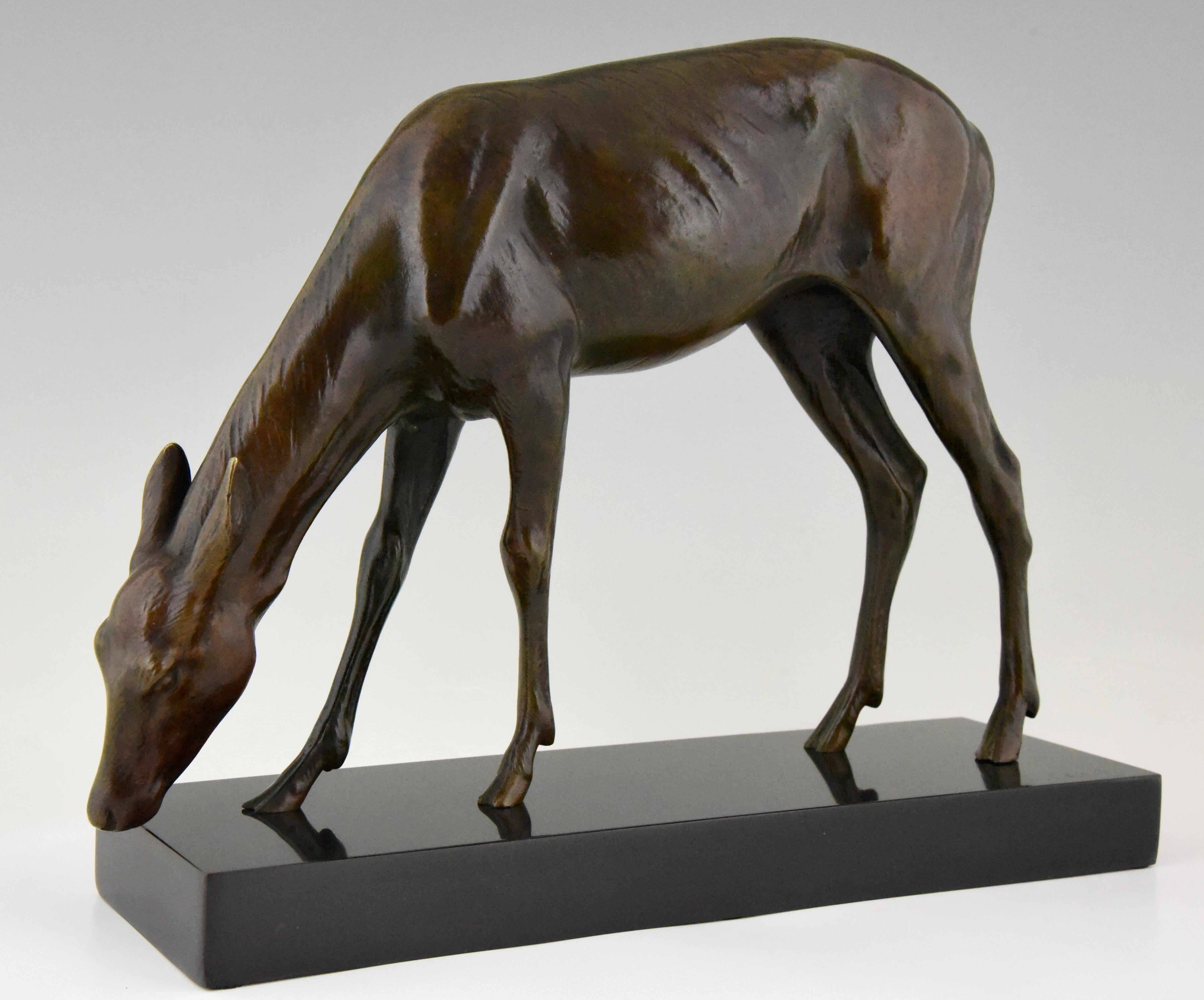 Beautiful Art Deco bronze sculpture of a female deer by the famous French sculptor Louis Riche. The bronze has a lovely dark brown patina and stands on a Belgian Black marble base, circa 1920.

      