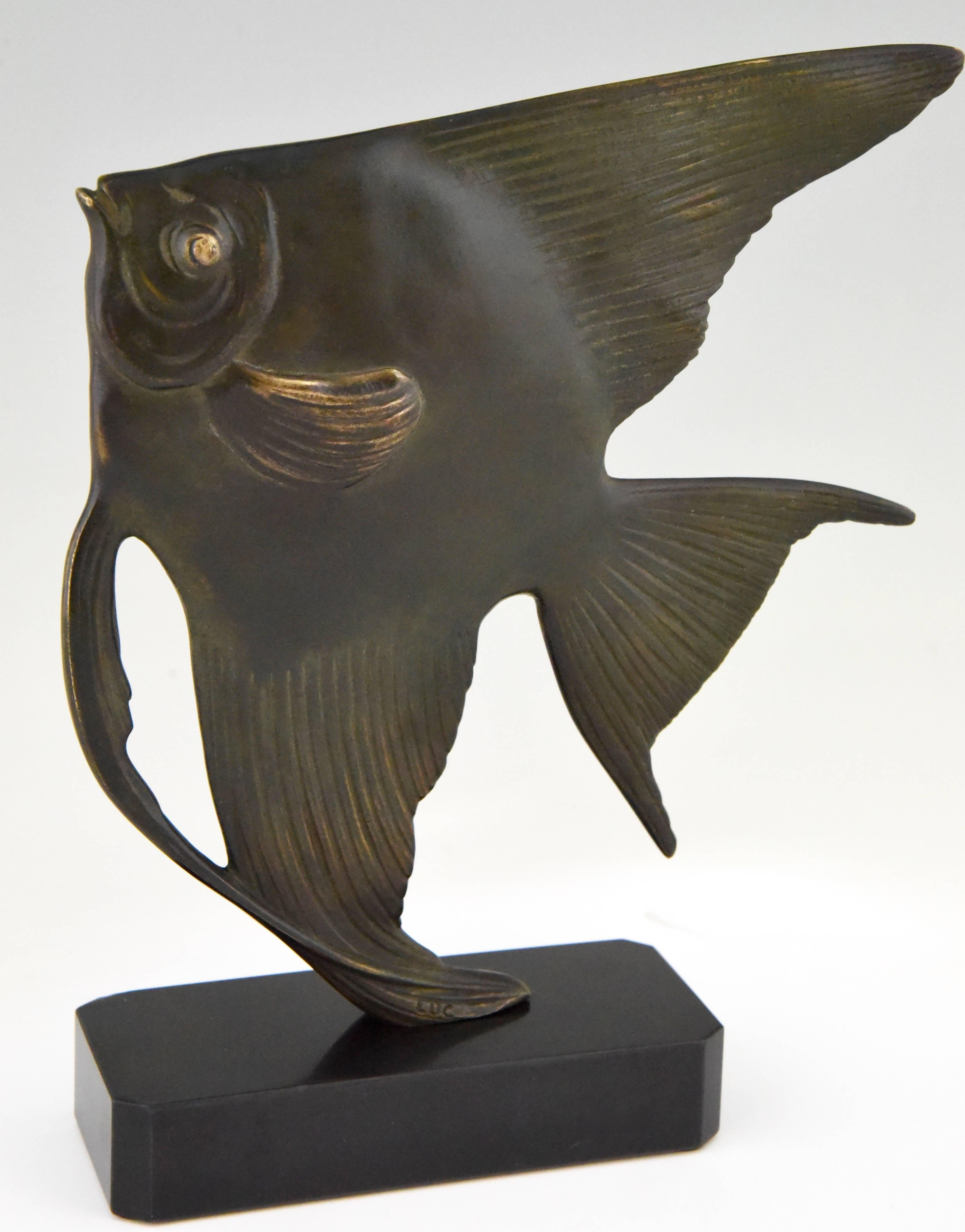 Description: Art Deco bronze sculpture of a fish
Artist/ Maker: Jean Luc.
Signature/ Marks: Luc. Bronze.
Style: Art Deco.
Date: 1930.
Material: Patinated bronze. Belgian black marble base.
Origin: France.
Size:
H 25 cm x L 19.5 cm x W 5.5