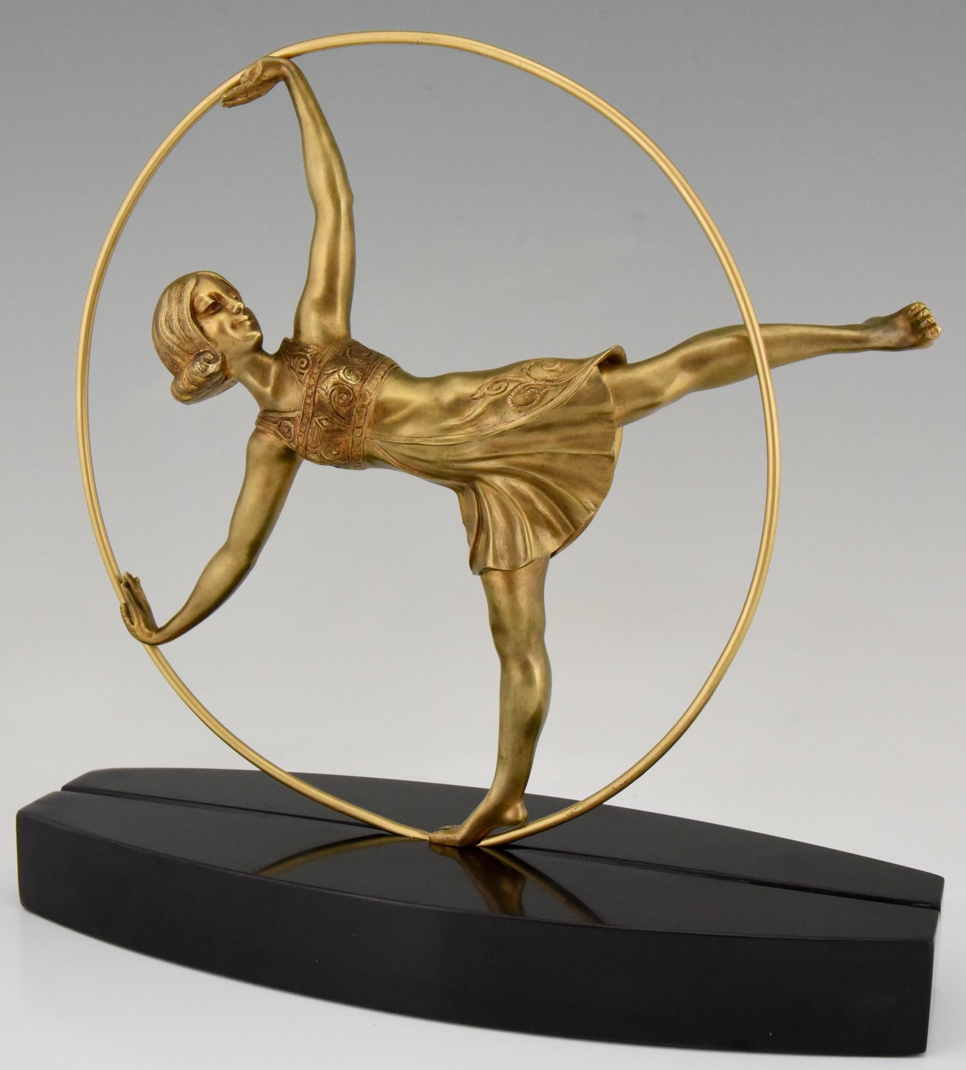 Stylish Art Deco bronze sculpture of a hoop dancer by Samuel Lipchytz.
The bronze sculpture has a gilt patina and stand on an oval Belgian black marble base, France, 1920.
Literature:
The sculpture is illustrated in “Art Deco and other figures”