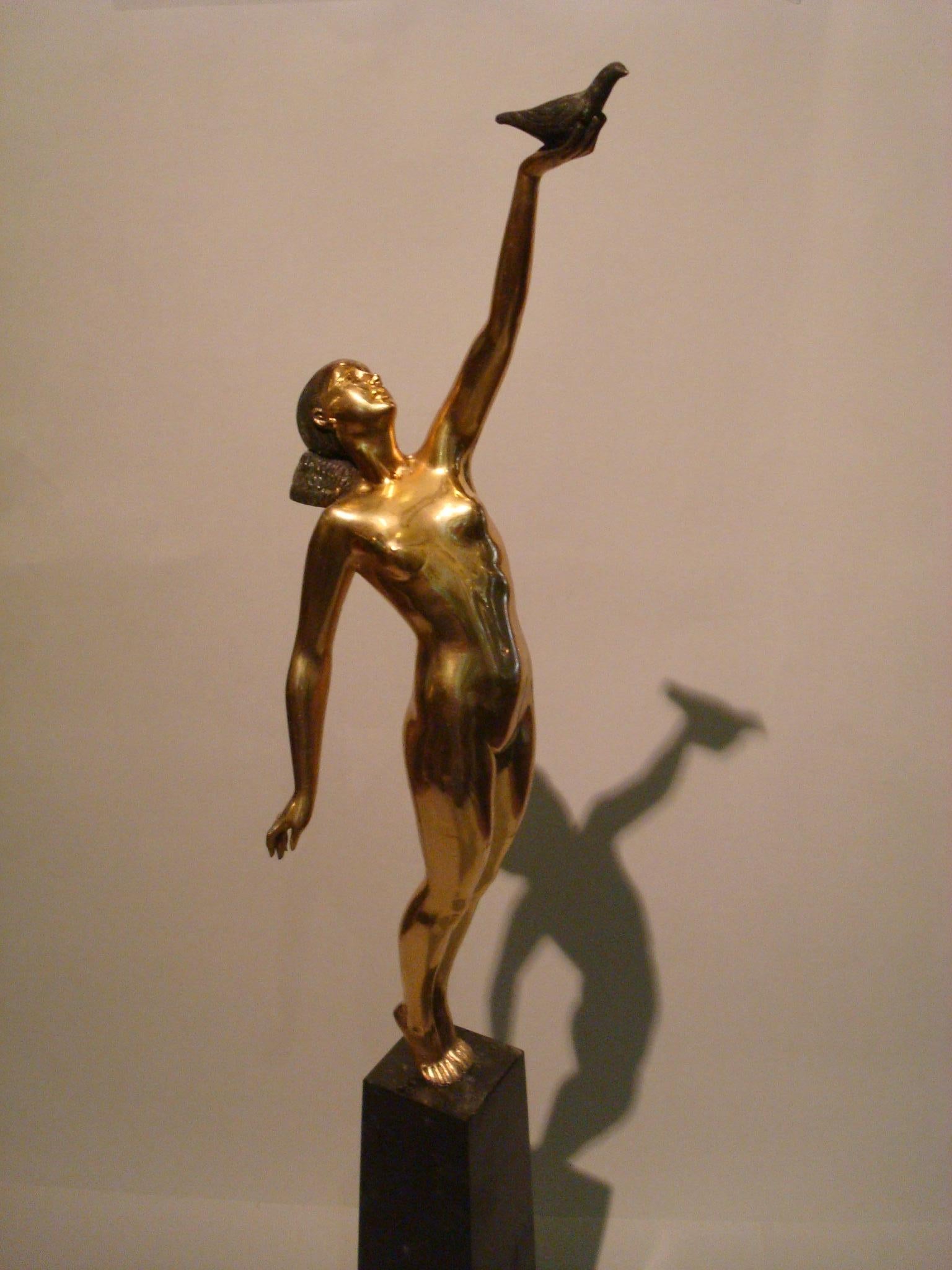 Art Deco bronze sculpture of a nude figure holding a dove by Pierre le Faguays Art Deco patinated bronze sculpture on a marble base depicting a nude figure holding a dove by Pierre le Faguays entitled message of love.
Made in France, circa