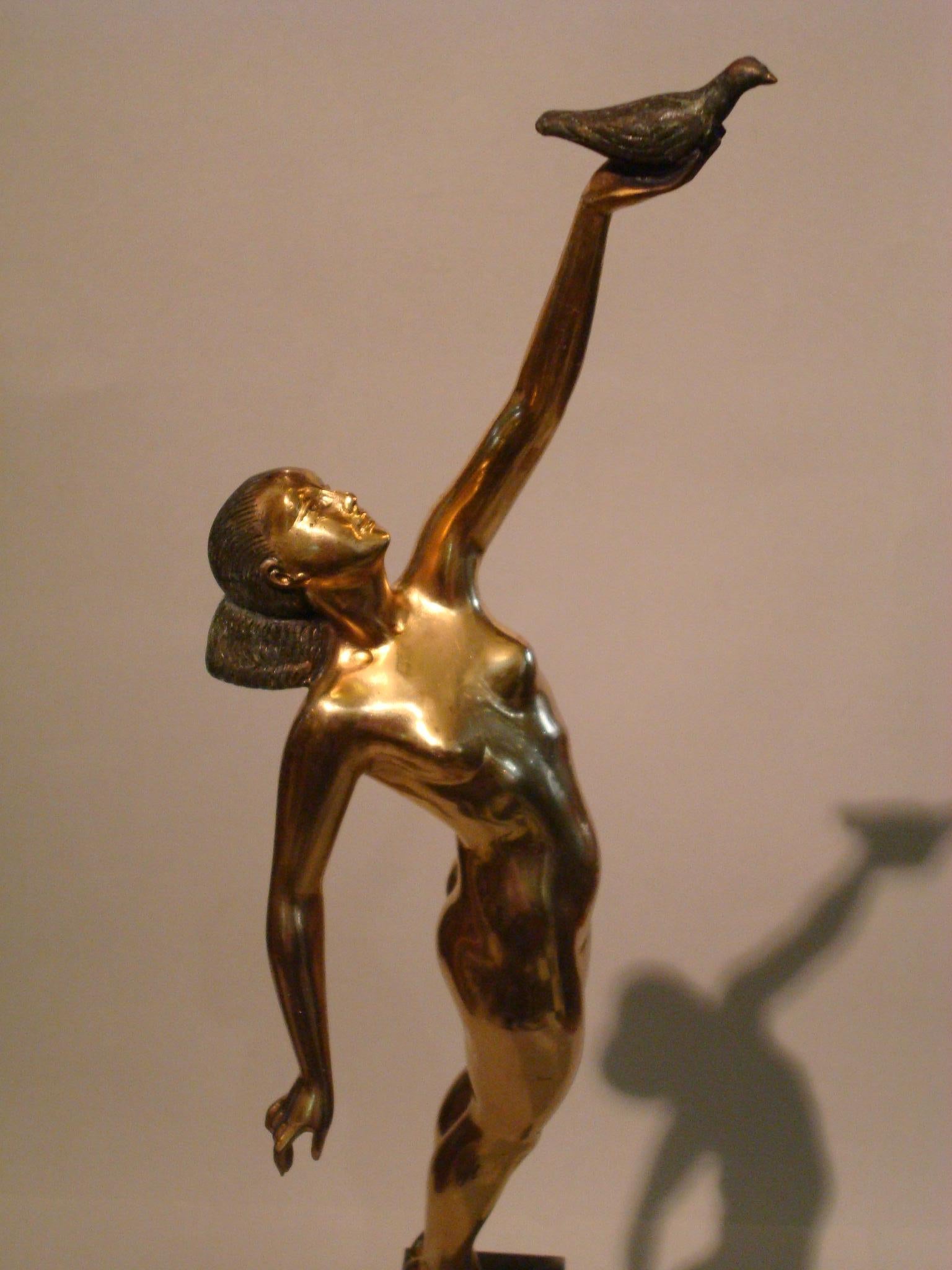 French Art Deco Bronze Sculpture of a Nude Figure Holding a Dove by Pierre Le Faguays