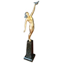 Art Deco Bronze Sculpture of a Nude Figure Holding a Dove by Pierre Le Faguays