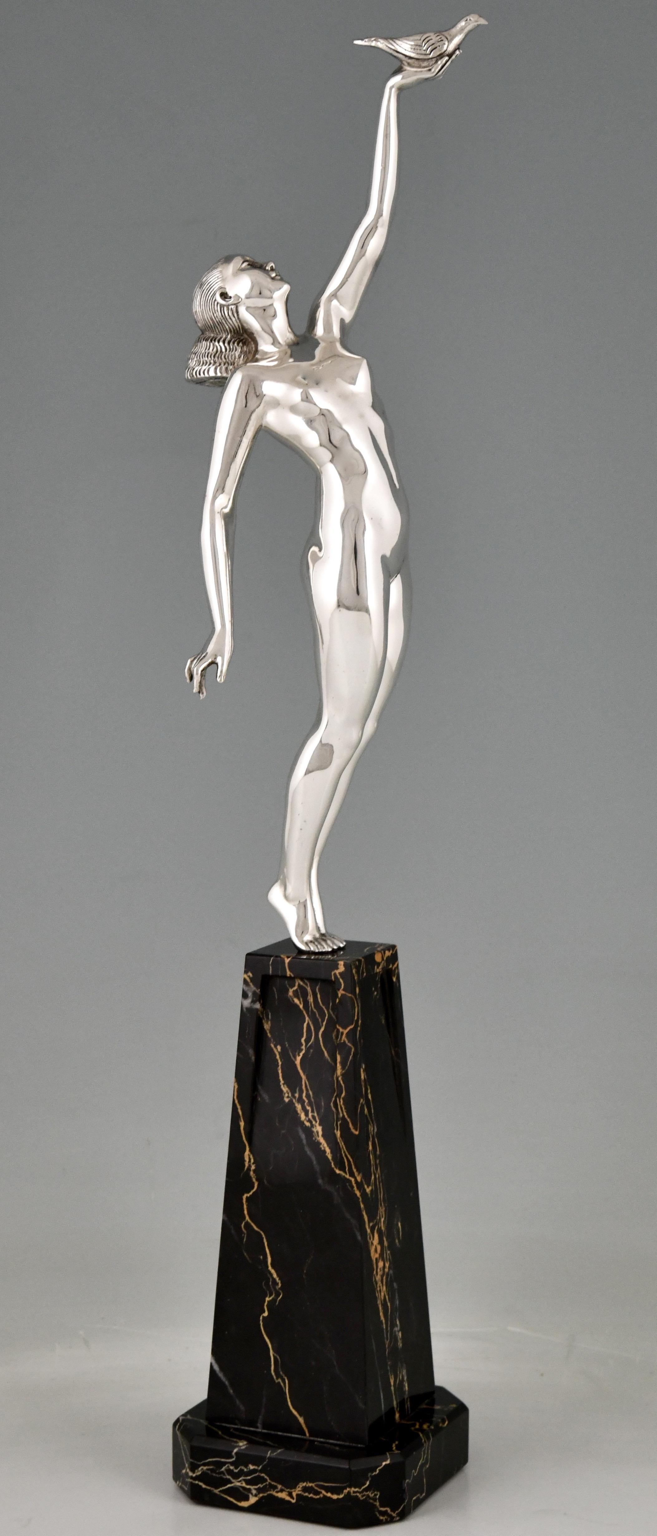Art Deco bronze sculpture of a nude with dove, message of love signed by Pierre Le Faguays. 
Silvered bronze statue on a fine Portor marble base. 
France 1925. Pierre Le Faguays, 1892 – 1962. 

About the artist:
Pierre le Faguays was born in