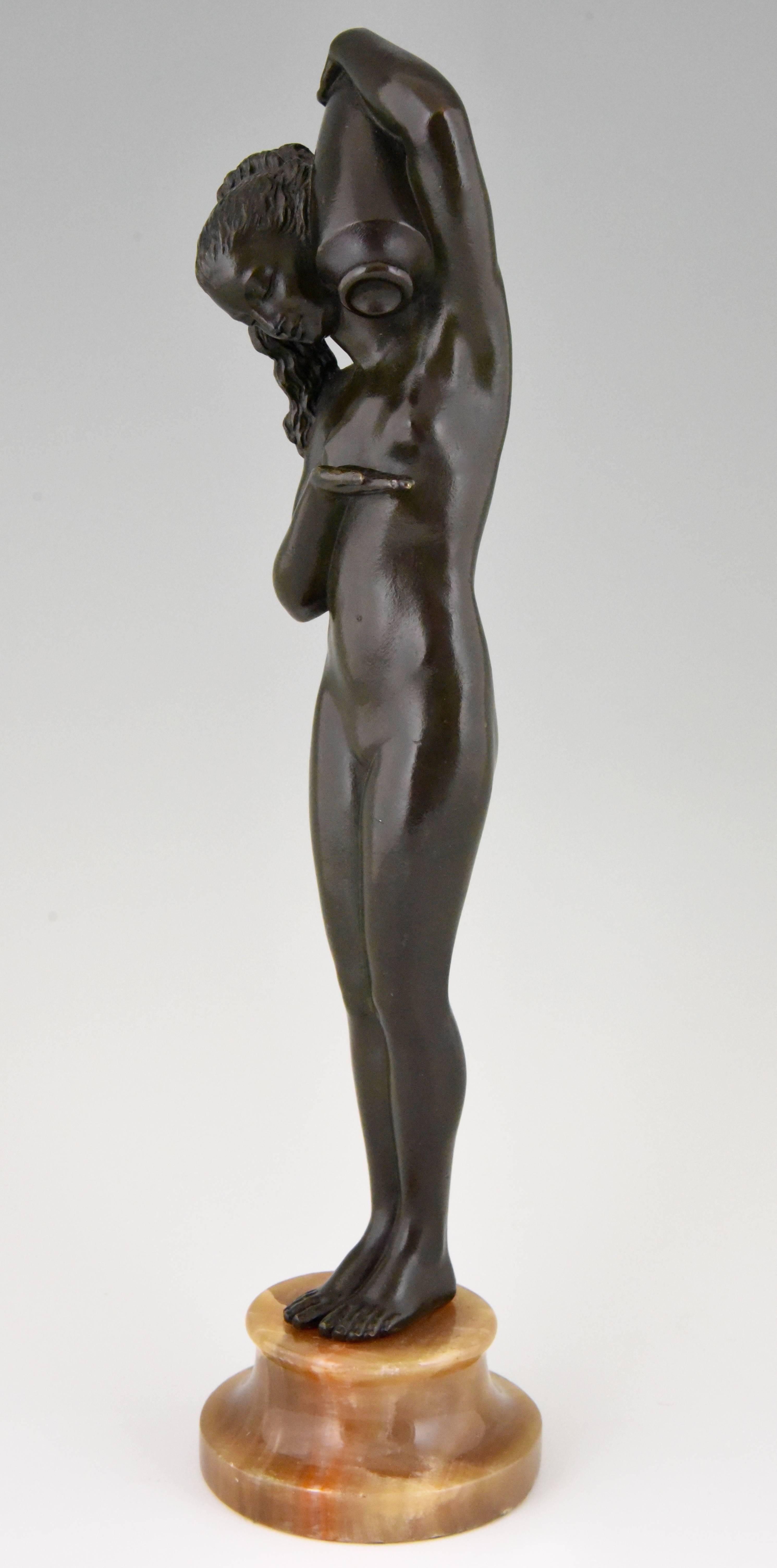 Description: Art Deco bronze sculpture of a nude with jar.
Artist/ Maker: Attributed to Raymonde Guerbe. The wife of Pierre Le Faguays.
Signature/ Marks: Unsigned.
Style: Art Deco.
Date: 1925.
Material: Patinated bronze. Onyx base.
Origin: