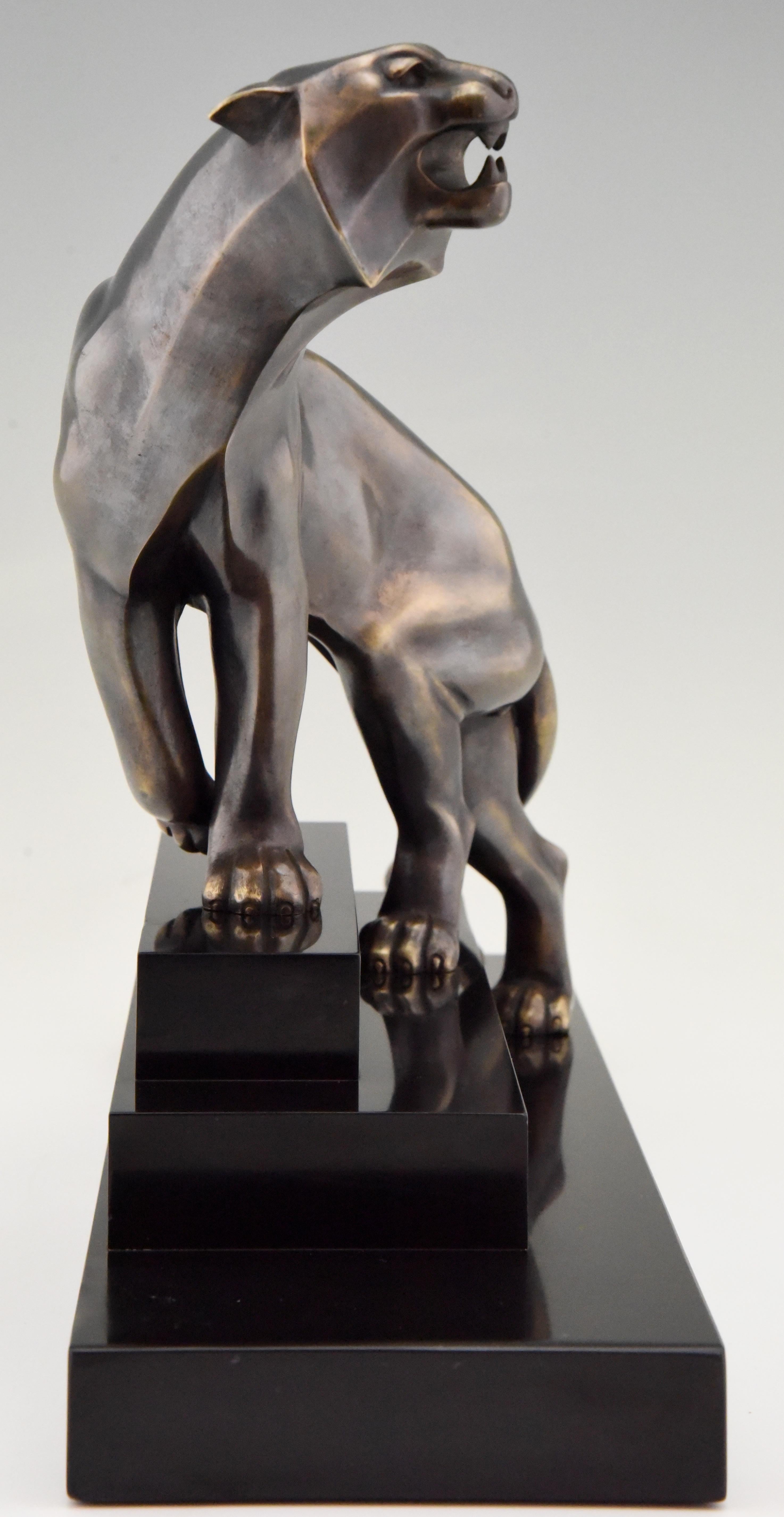Beautiful Art Deco bronze sculpture of a panther by Georges Lavroff on a stepped Belgian black marble base, France, 1925. The artist was born in Russia in 1895, he lived and worked in France. Work in Musea and private collections.

This panther is
