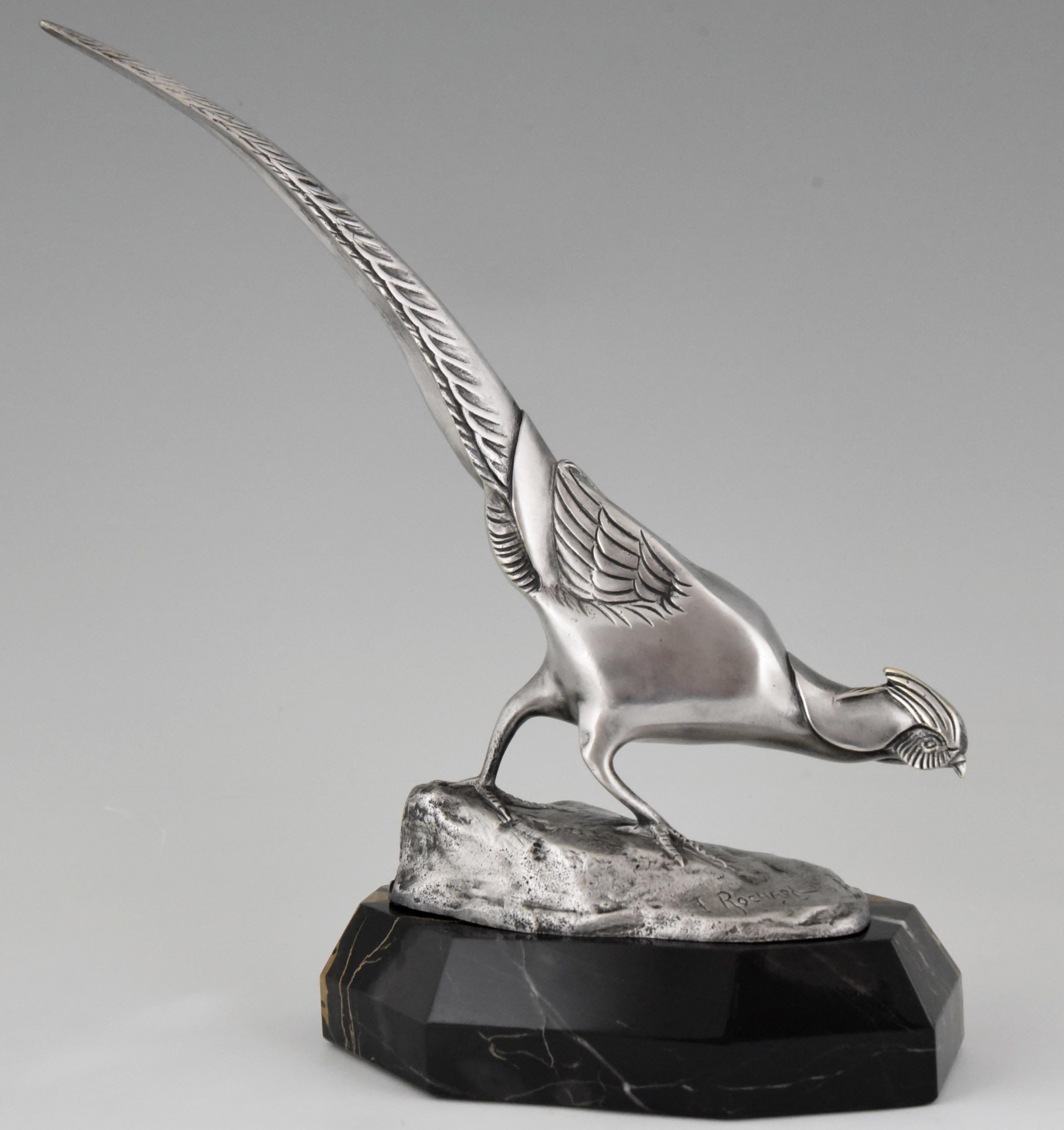 Very nice bronze Art Deco sculpture of a pheasant with lovely silver patina, mounted on a Portor marble base. Signed by Irenee Rochard, France, 1925.
“Animals in bronze” by Christopher Payne. Antique collectors club. “Dictionnaire des peintres,