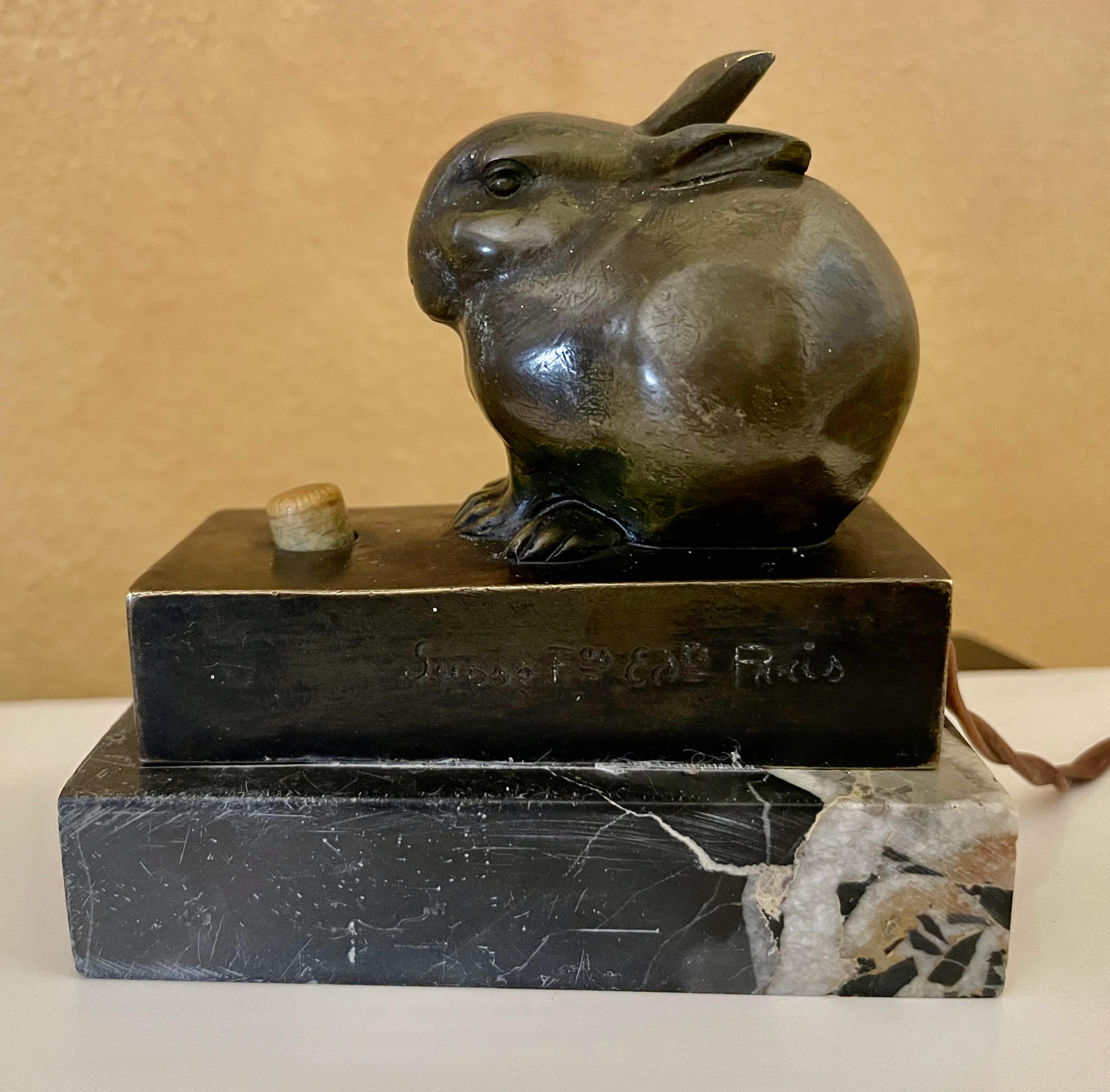 Bronze rabbit figurine, circa 1920, finished in original dark patinated bronze, signed around the lower edge, E.M. Sandoz also with “Susse F. Ed Paris” signature as well. Sitting on a bronze base and mounted on a marble base. Fun and unusual details