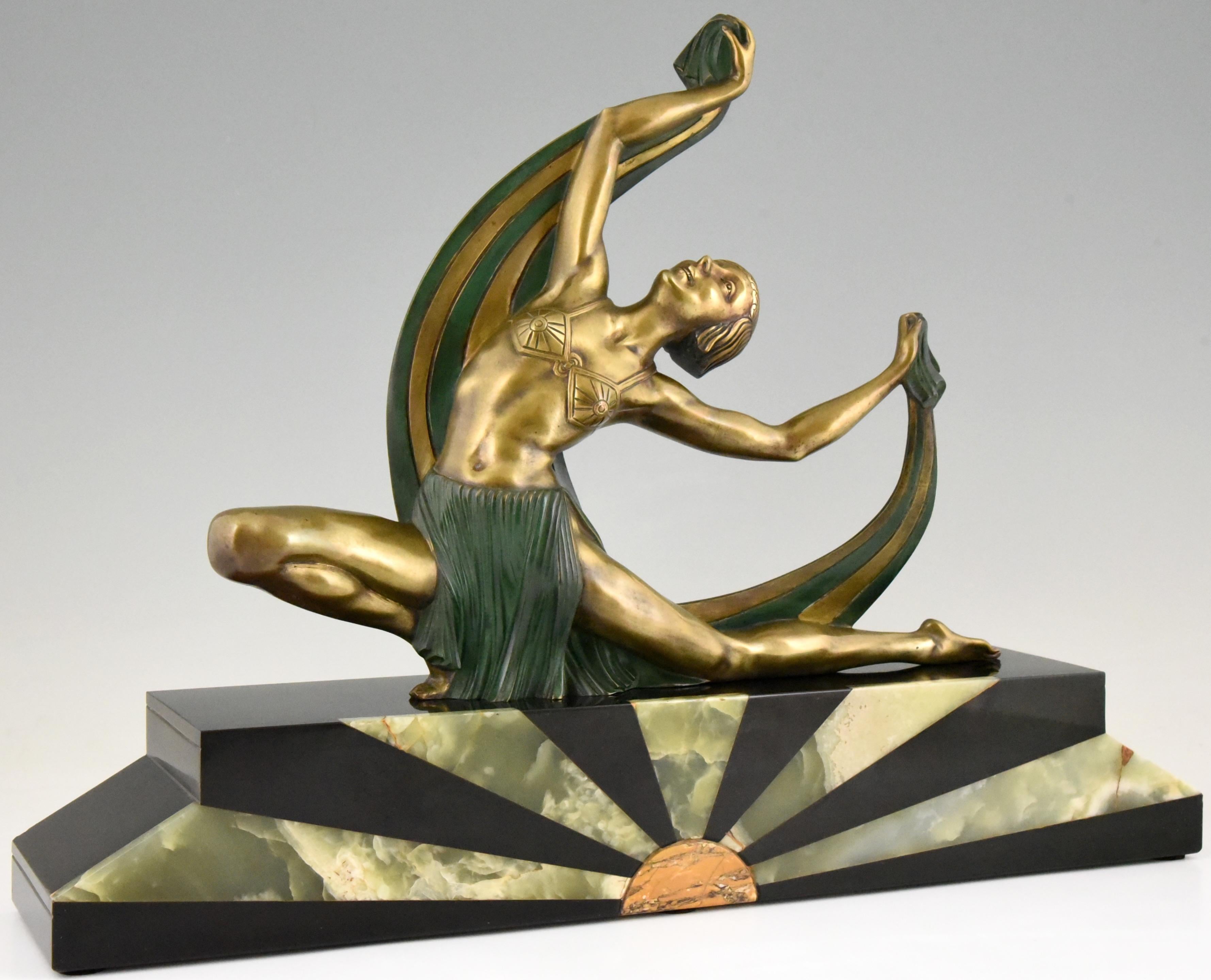 Impressive Art Deco bronze sculpture of a scarf dancer by Jean Lormier. The sculpture is mounted on a Belgian Black marble base with onyx sunburst inlay, France, 1925.
Literature:
“Art Deco and other figures” by Brian Catley. ?“Art deco sculpture”