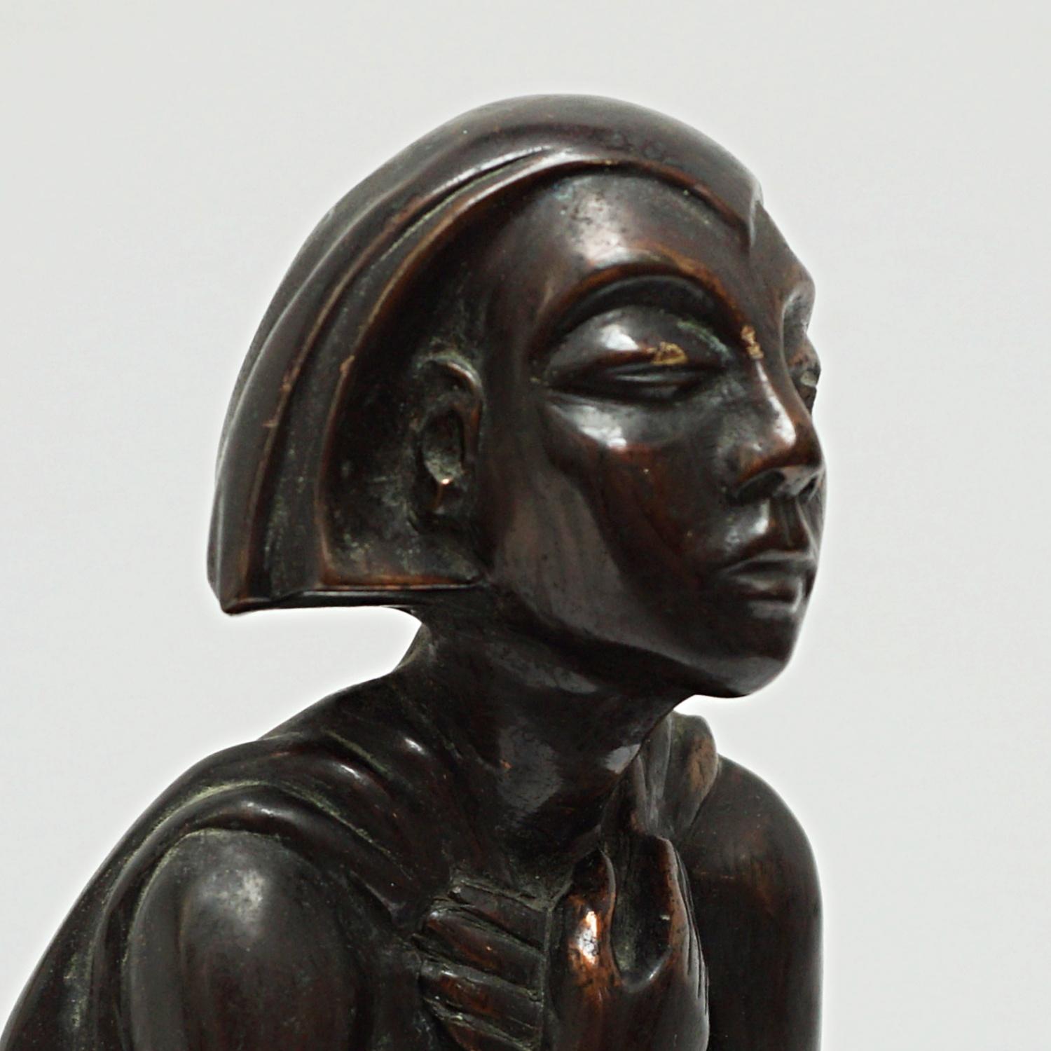 An Art Deco bronze figure of a standing woman clutching her hands to her chest wearing a cloak. Unsigned.

Dimensions: H 38cm W 12cm D 10cm

Origin: English

Date: Circa 1920

Item Number: 2309226.