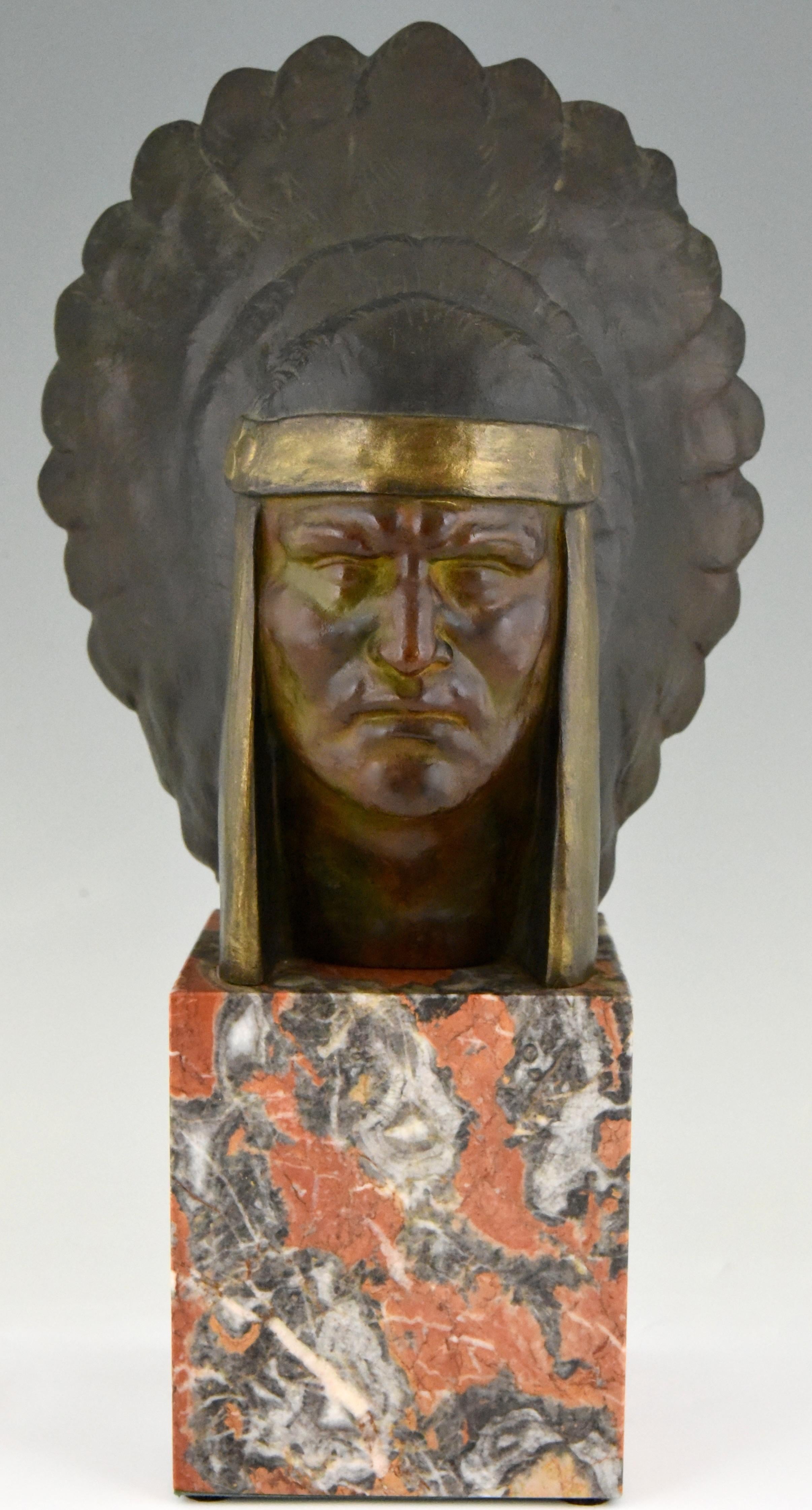 Impressive Art Deco bronze bust of an Indian with headdress by the French artist Georges Garreau. The sculpture has a beautiful multi-color patina and stands on a marble base, circa 1930.
Literature:
“Dictionnaire illustré des sculpteurs