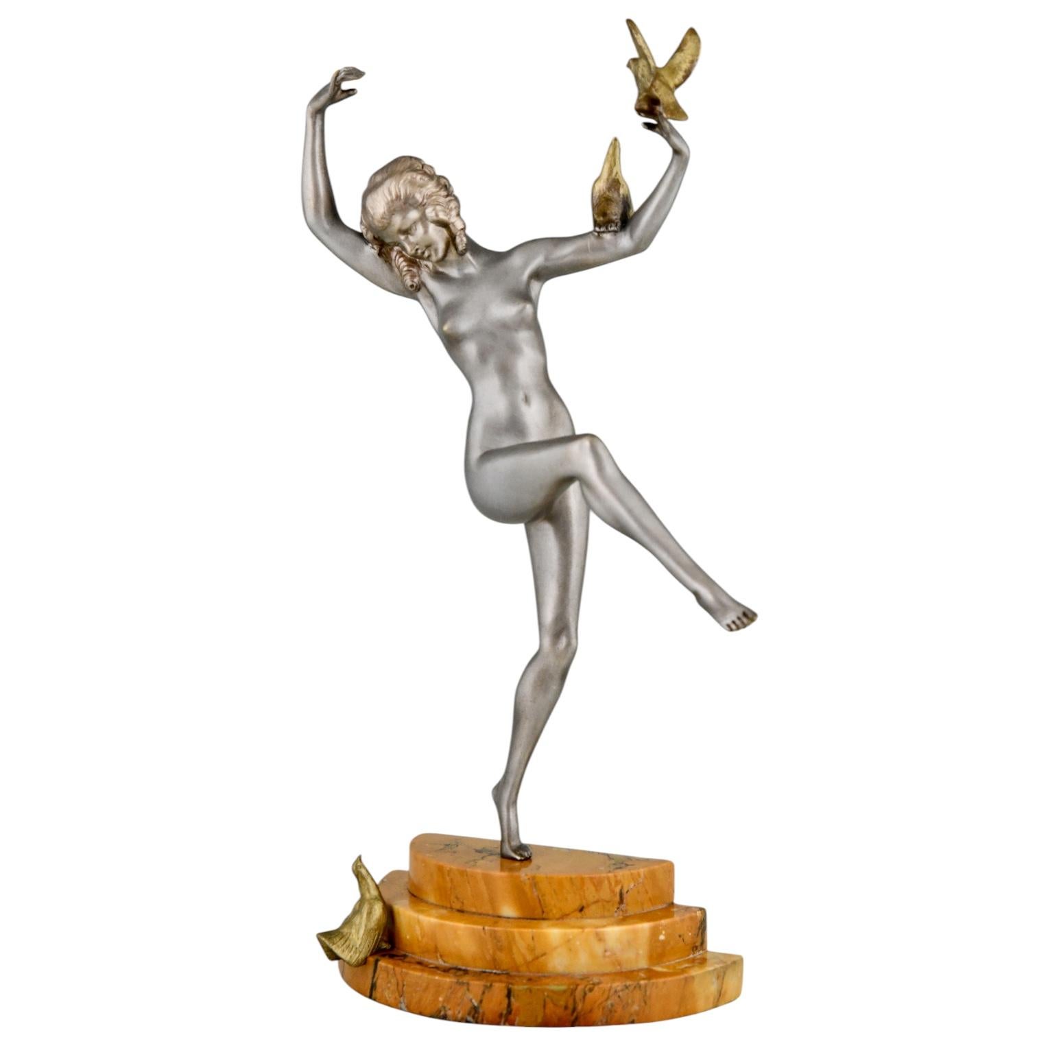 Art Deco bronze sculpture of dancing nude with birds signed Matto, pseudonym of Marcel André Bouraine. 
Bronze with silver & gold patina, orange marble base. 
France 1930. 
Illustrated in: Statuettes of the Art Deco period, Alberto