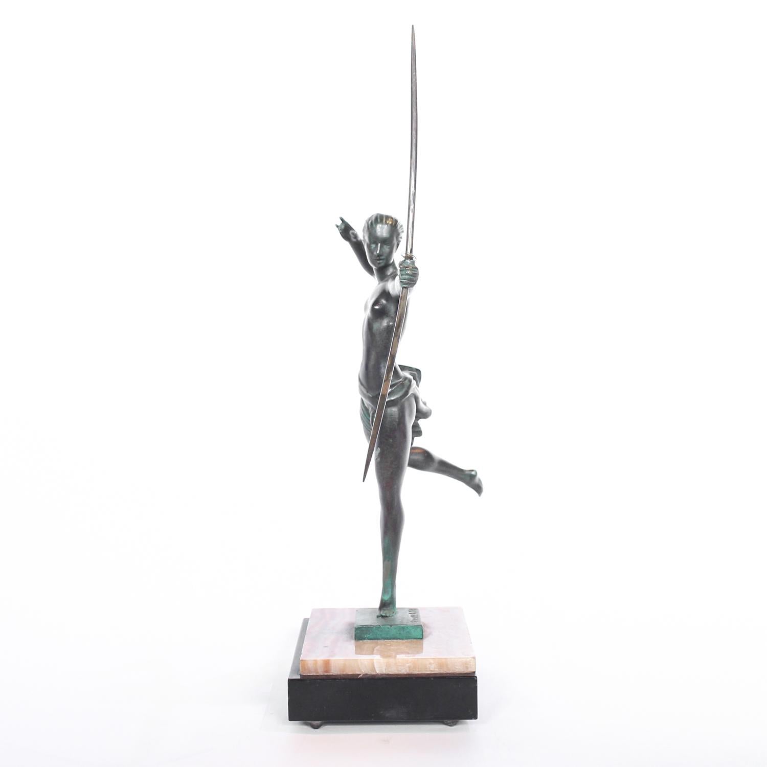 An Art Deco, patinated bronze figure of Diana the huntress mounted on a marble base. Signed 'Domaro'.





 