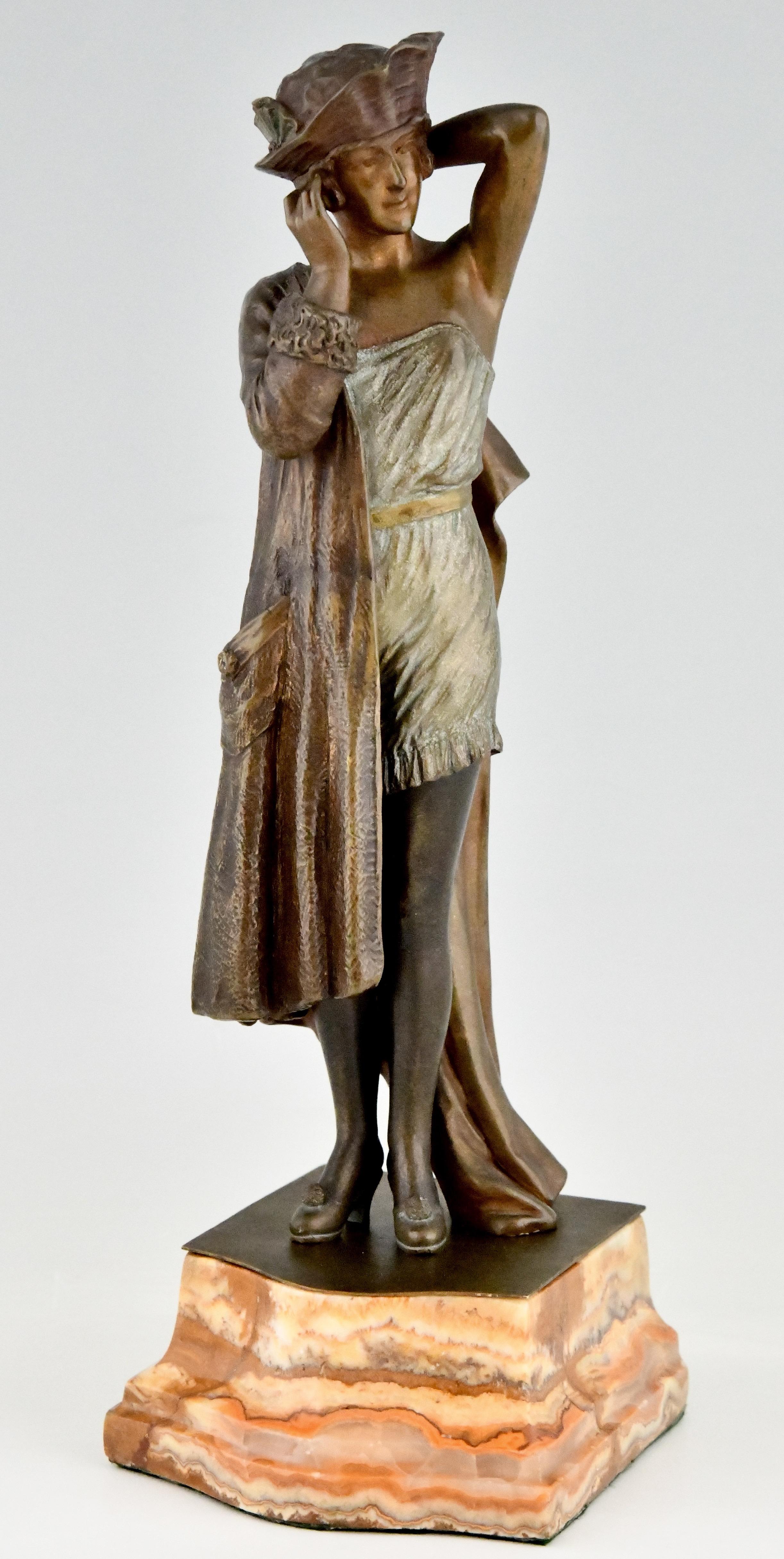 Art Deco bronze sculpture of a lady in underwear and dressing gown trying on a hat. Coquetterie Matinale. Morning coquetry by Joanny Durand, France 1886-1952. Patinated bronze on a marble base.
Literature:
The dictionary of sculptors in bronze,