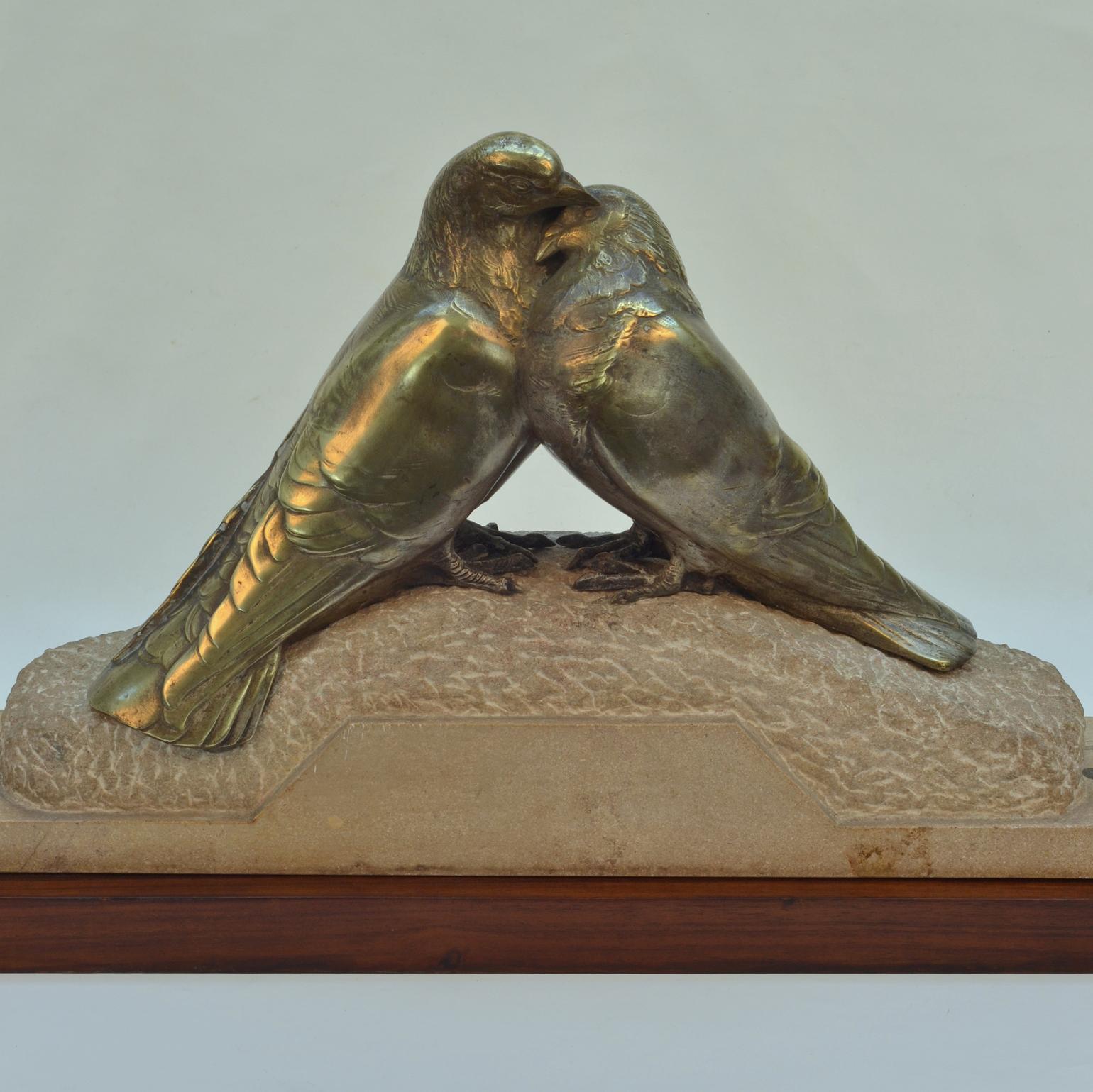 Colombes amourueses, air of embracing Doves was sculpted by Pierre Alexandre Morlon. These remarkable carved birds are nuzzling perched on a carved marble stone base which sits on a mahogany wooden plinth. The bronze is part silvered. The Doves