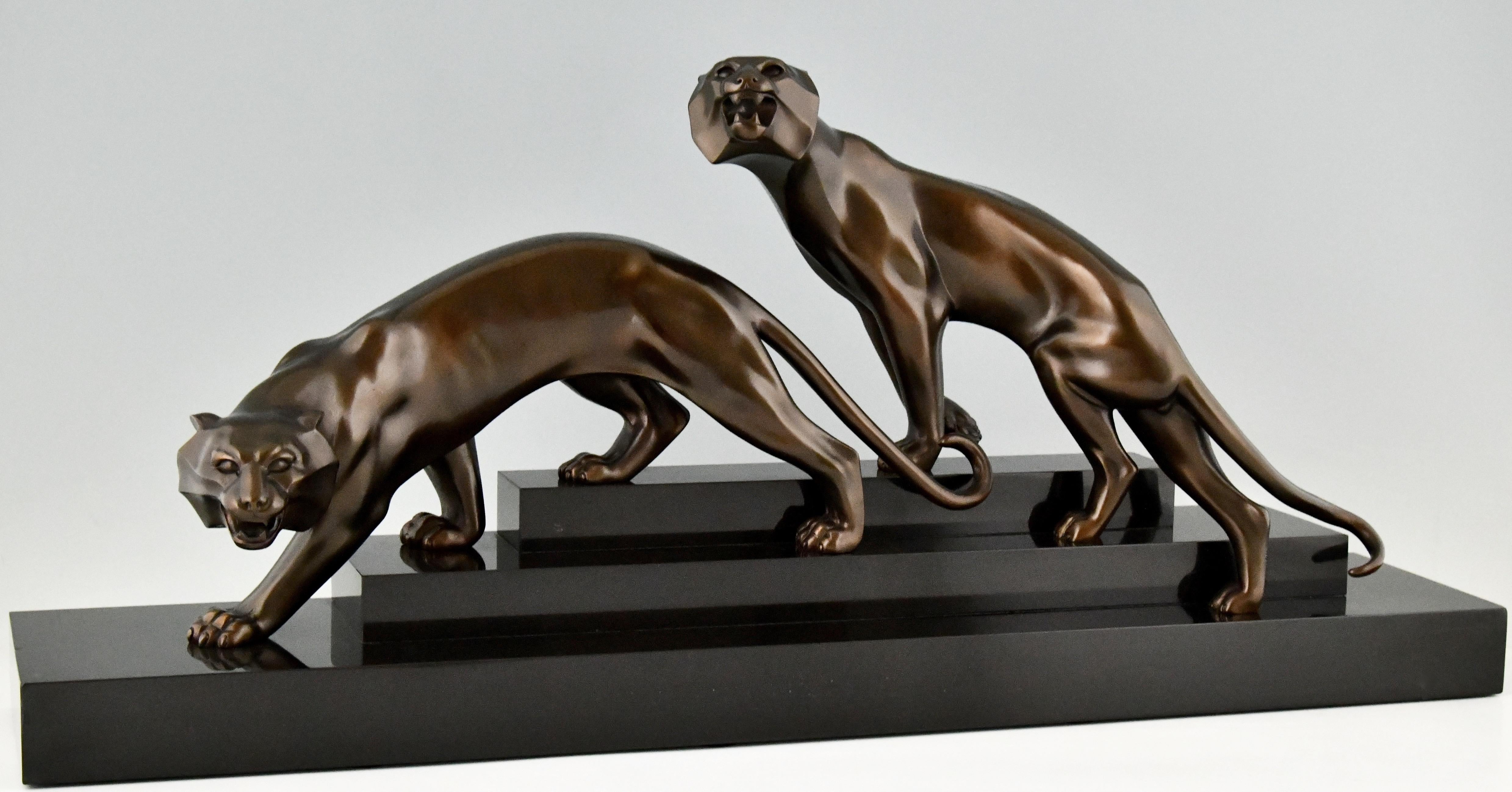Impressive Art Deco bronze sculpture of two panthers By Georges Lavroff. Born in Russia in 1895, lived and worked in France. Marcel Guillemard foundry seal. Patinated bronze on stepped Belgian Black marble base.
This panther group is 3 times
