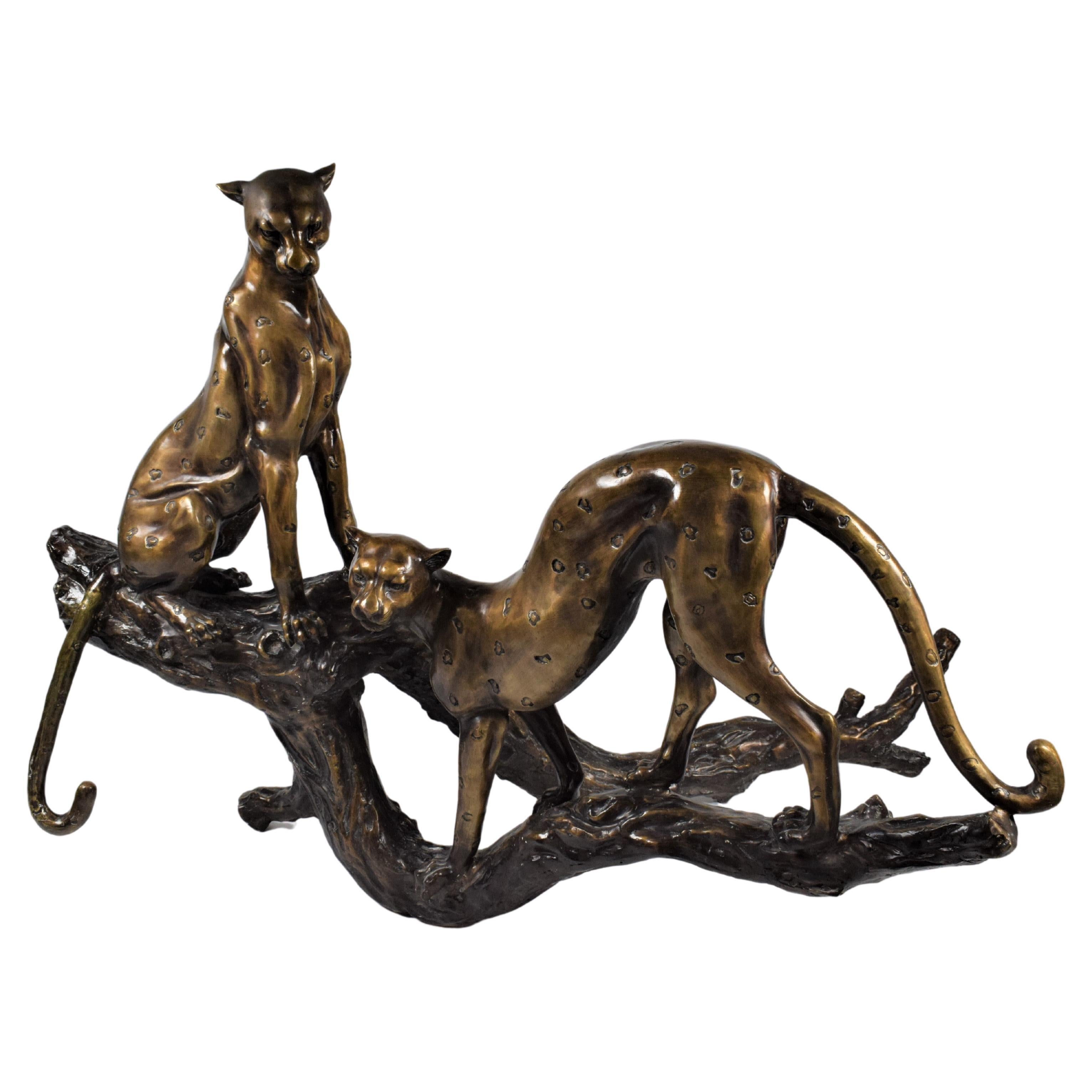 Art Deco Bronze Sculpture of Two Resting Cheetah's on a Trunk For Sale