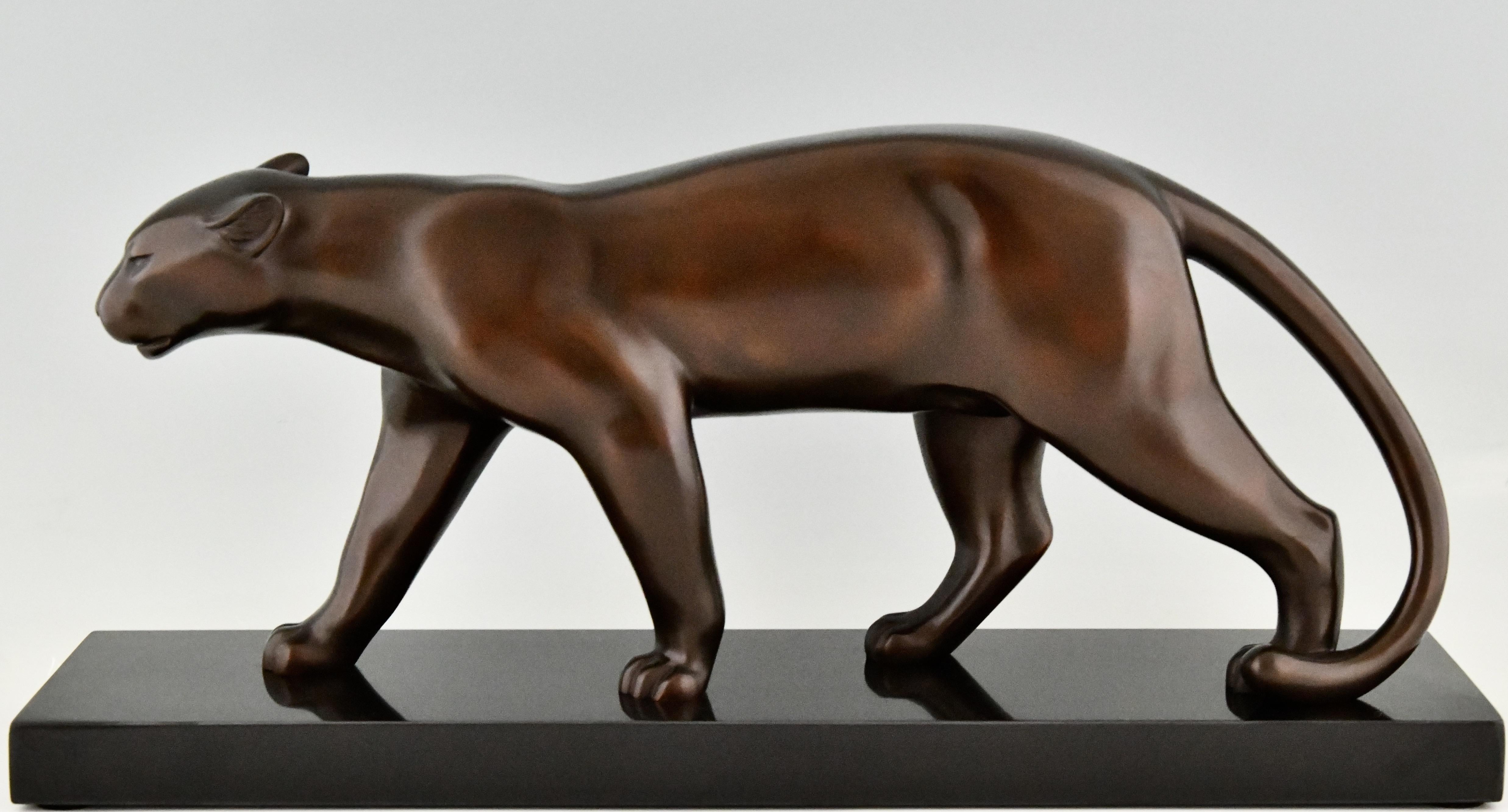 Stylish Art Deco bronze sculpture of walking panther by Emile Louis Bracquemond, bronze with brown patina, on a Belgian black marble base. France 1930. 
This panther is mentioned in the book 
Dictionnaire illustré des sculpteurs animaliers &