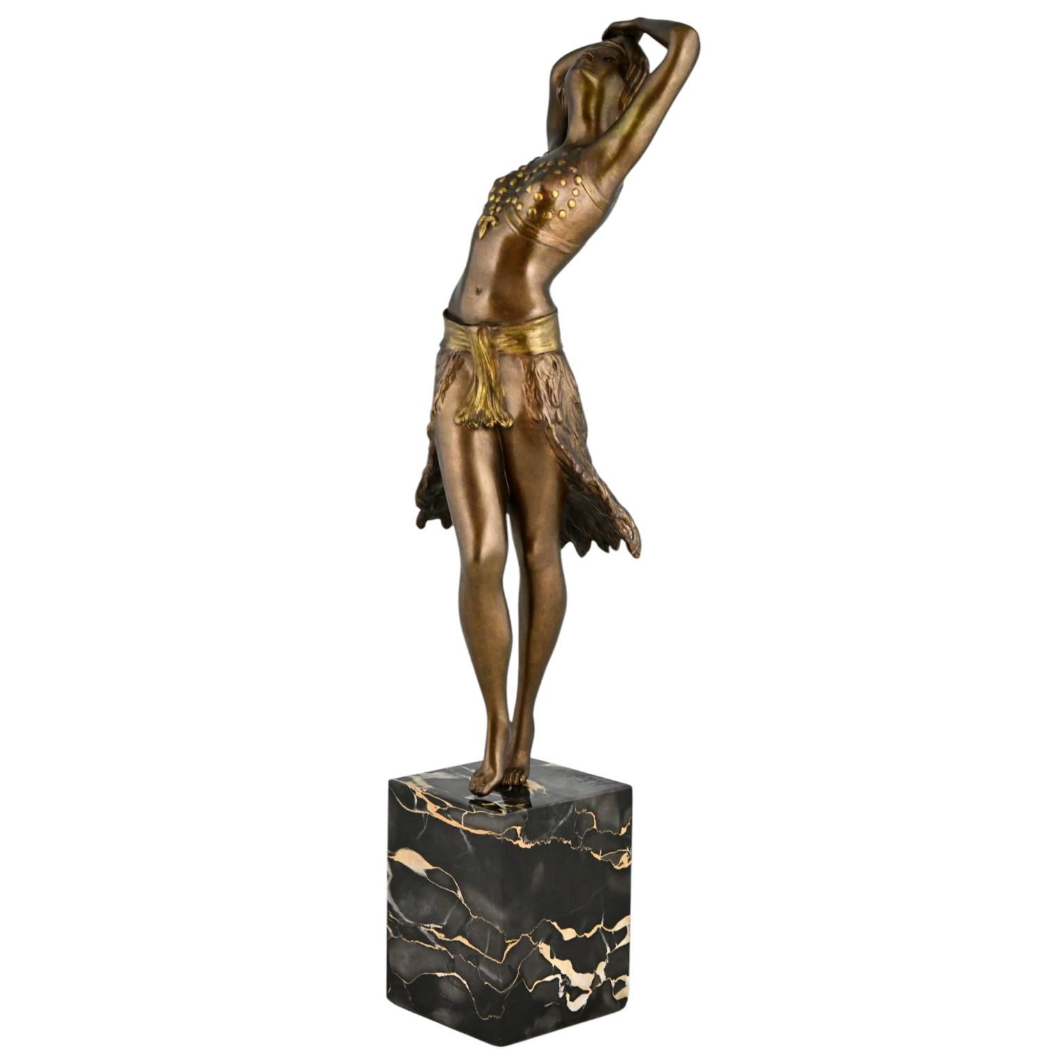 Art Deco bronze sculpture oriental dancer Henry Fugère.
Bronze sculpture, patinated. Portor Marble base. 
France 1925. 

Literature: 
Art Deco and other figures by Brian Catley
Antique collectors club. 
Statuettes of the Art Deco period by Alberto