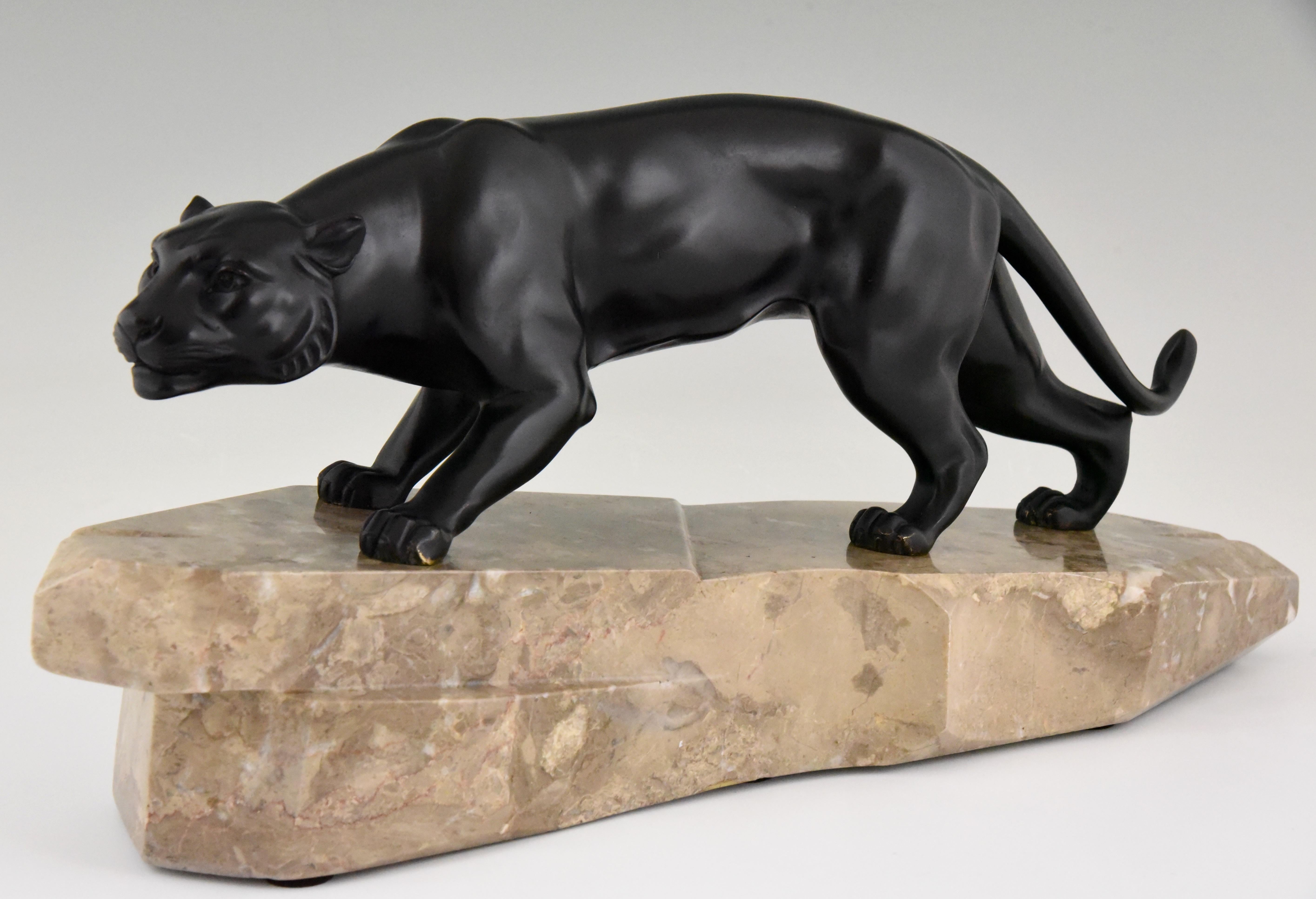 Typical Art Deco panther sculpture in patinated bronze on a marble base. The work is signed by J. Brault, cast in France, circa 1930.