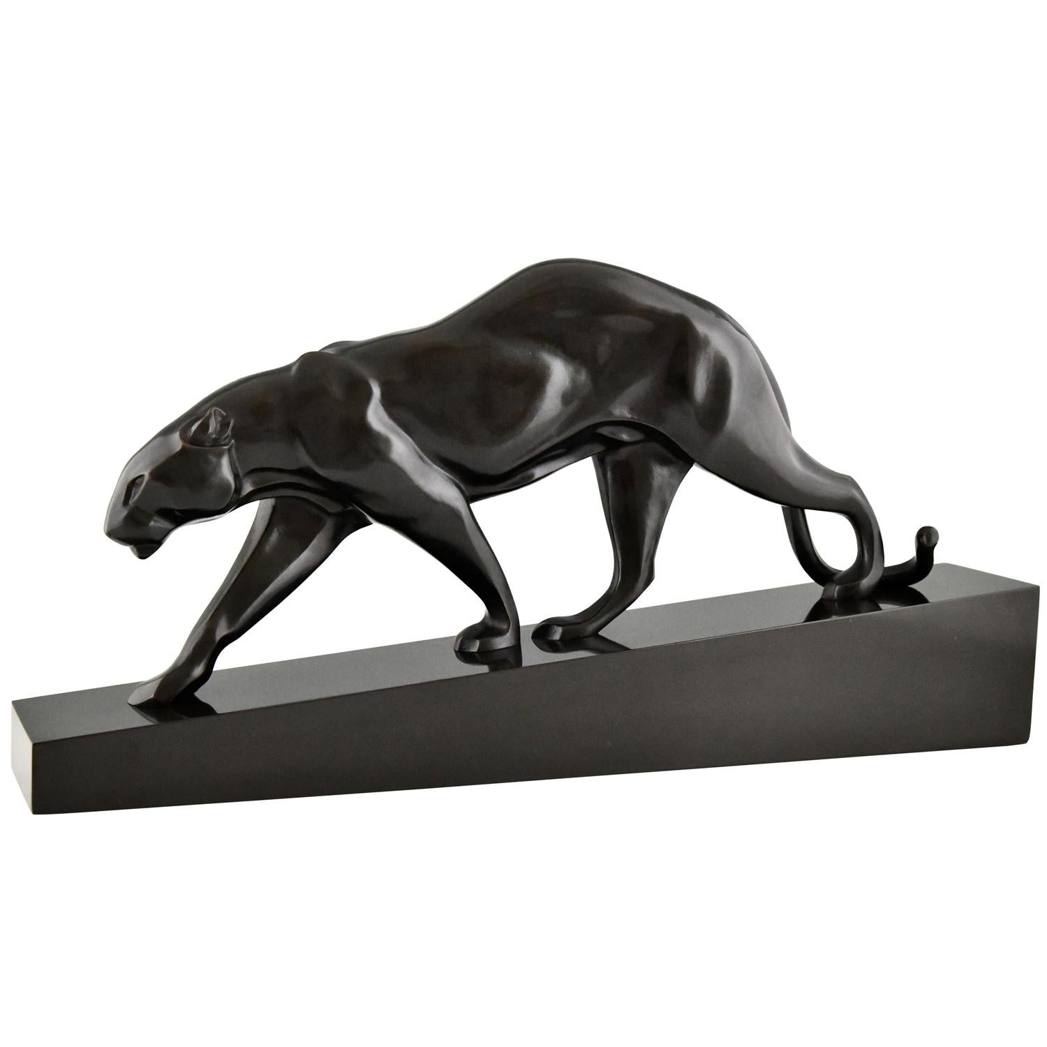 Art Deco bronze sculpture of a panther by Maurice Prost.
Signed M. Prost and Susse frères Editeurs Paris. 
Bronze with black patina on a Belgian Black Marble base. 
This bronze is illustrated in:
Art Bronzes, Michael Forrest and in
Susse