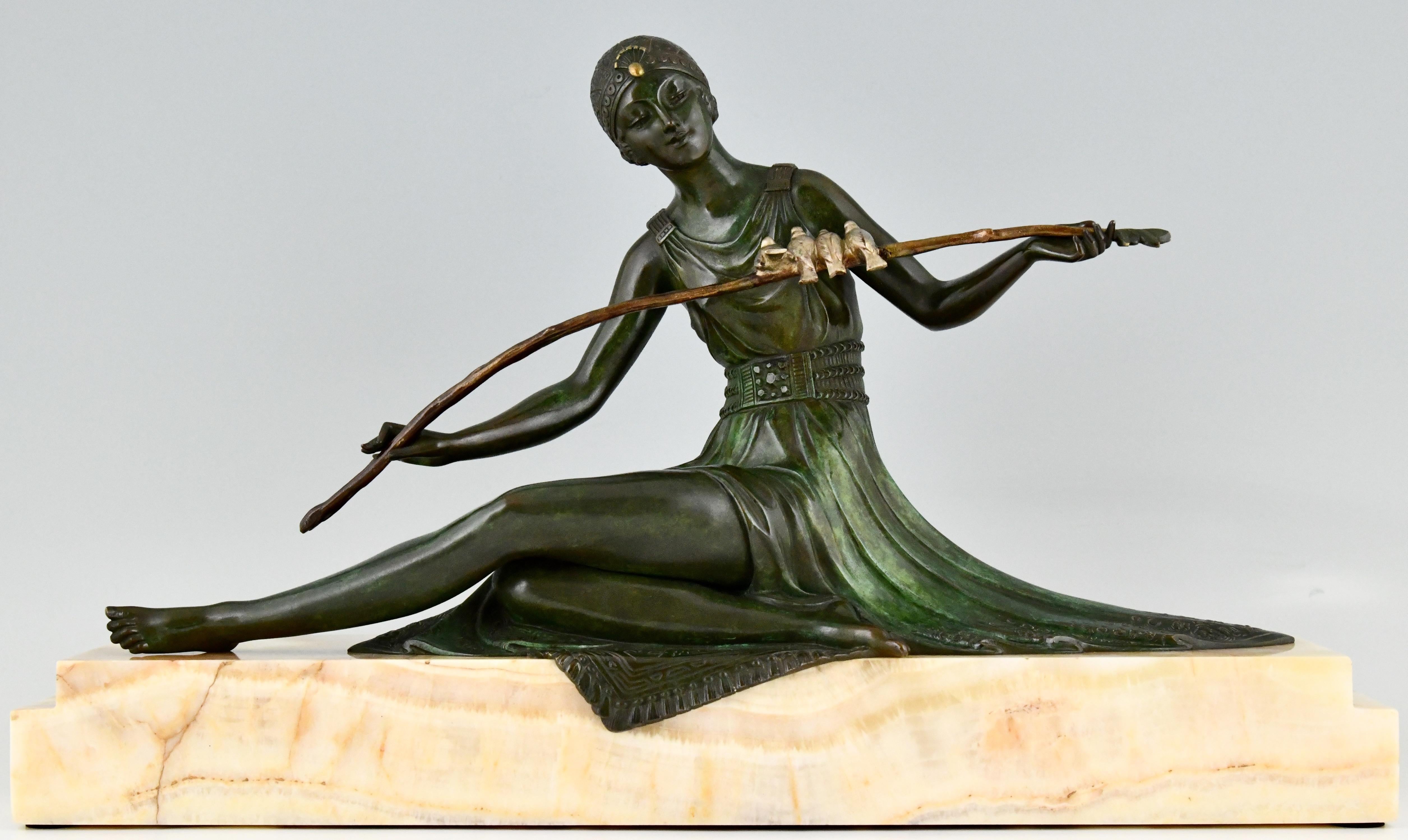 Art Deco bronze sculpture of a seated lady holding a branch with birds
by the well known French artist Joe Descomps.
The bronze has a beautiful patina and is mounted on a yellow marble base. Ca. 1930. 

Literature: “Art Deco and other figures”
