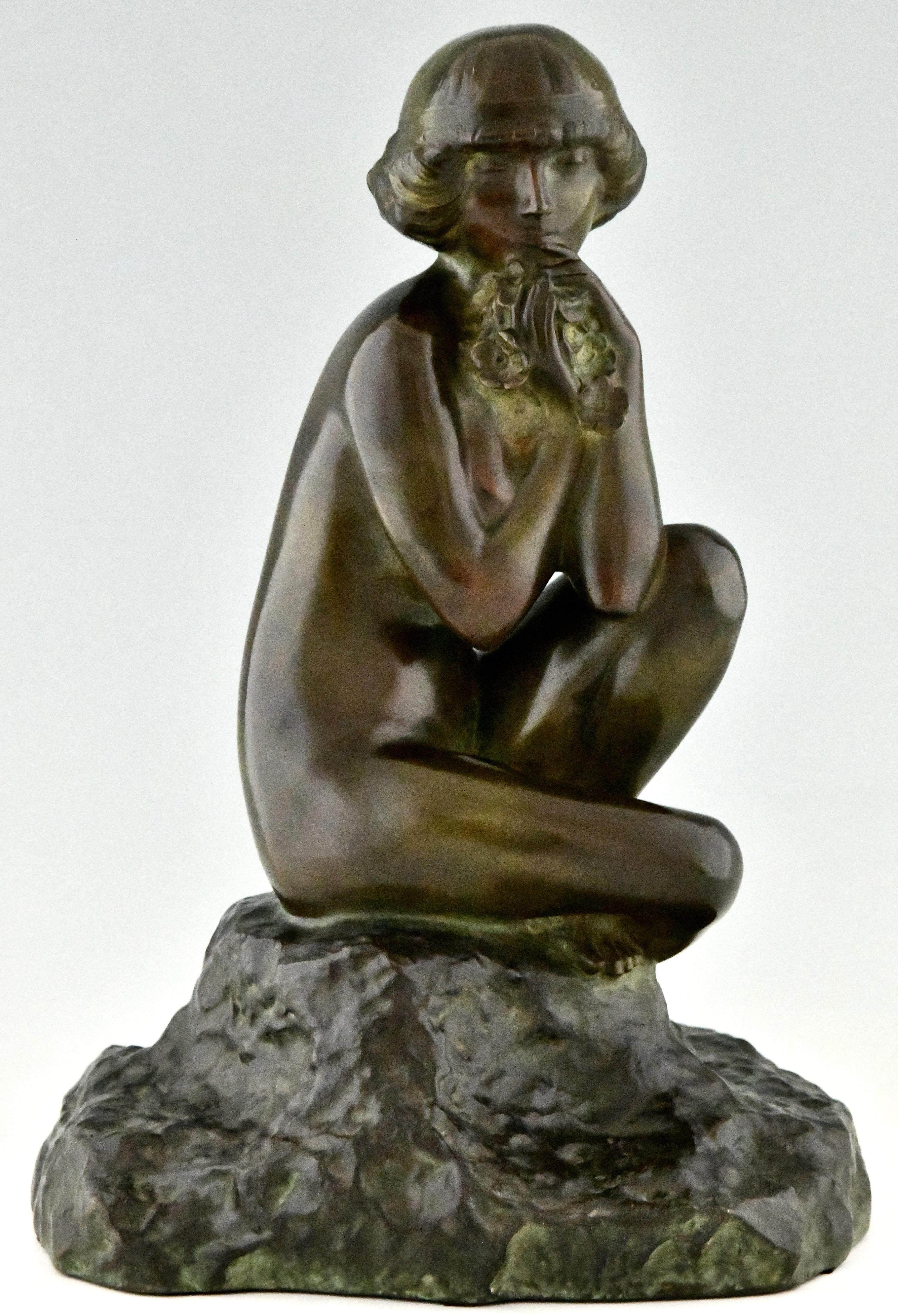 Art Deco bronze sculpture seated nude with flowers by Maxime Real del Sarte, France 1888-1954. Ca. 1920

Information about the artist:
Bronzes, sculptors and founders by H. Berman, Abage. 
The dictionary of sculptors in bronze by James Mackay.