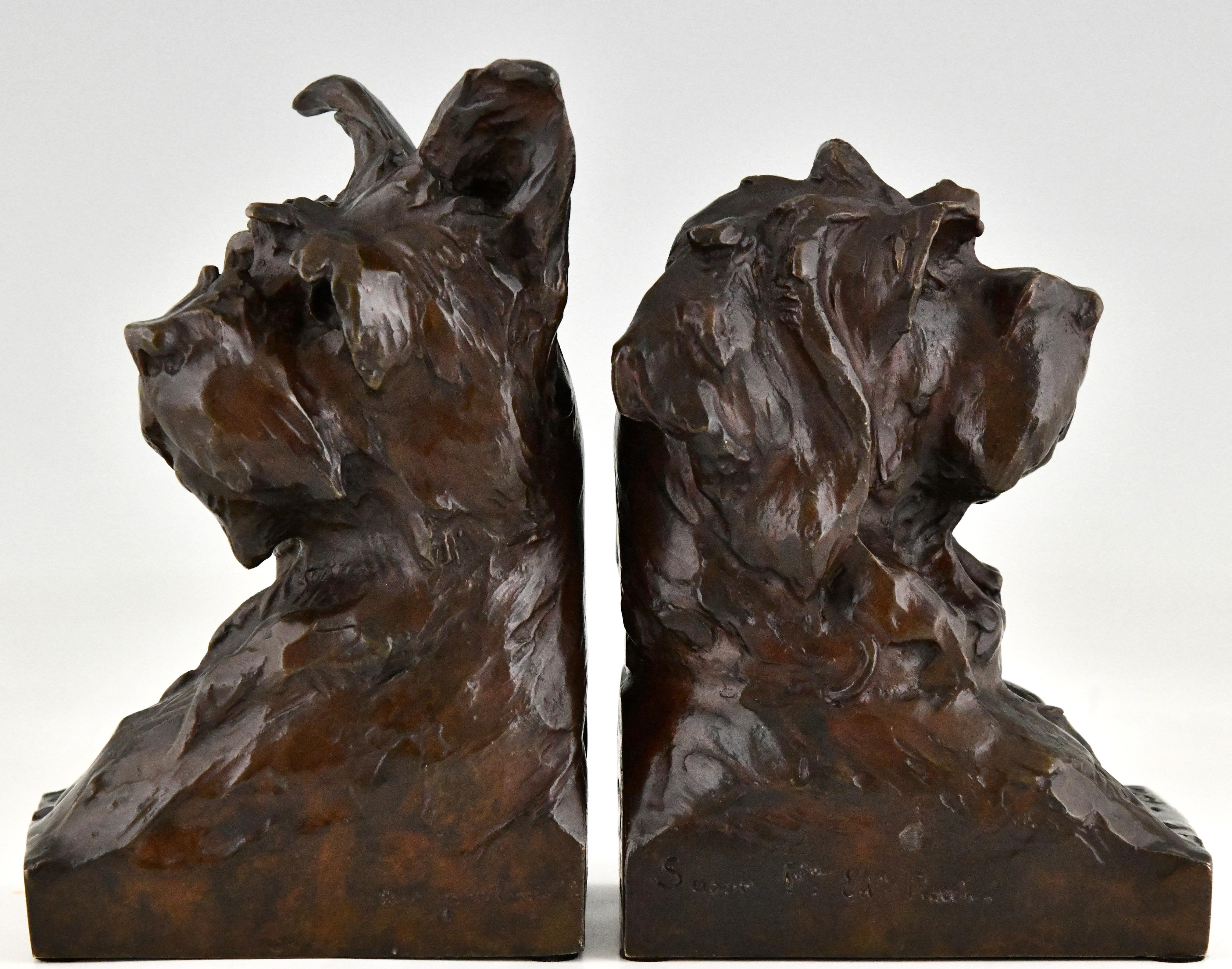 Art Deco bronze bookends in the shape of terrier dog busts by the French artist Maximilien Louis Fiot, 1886-1953. The sculptures have a beautiful patina and are signed by the artist as well as by the founder, Susse Freres. The dog sculptures are