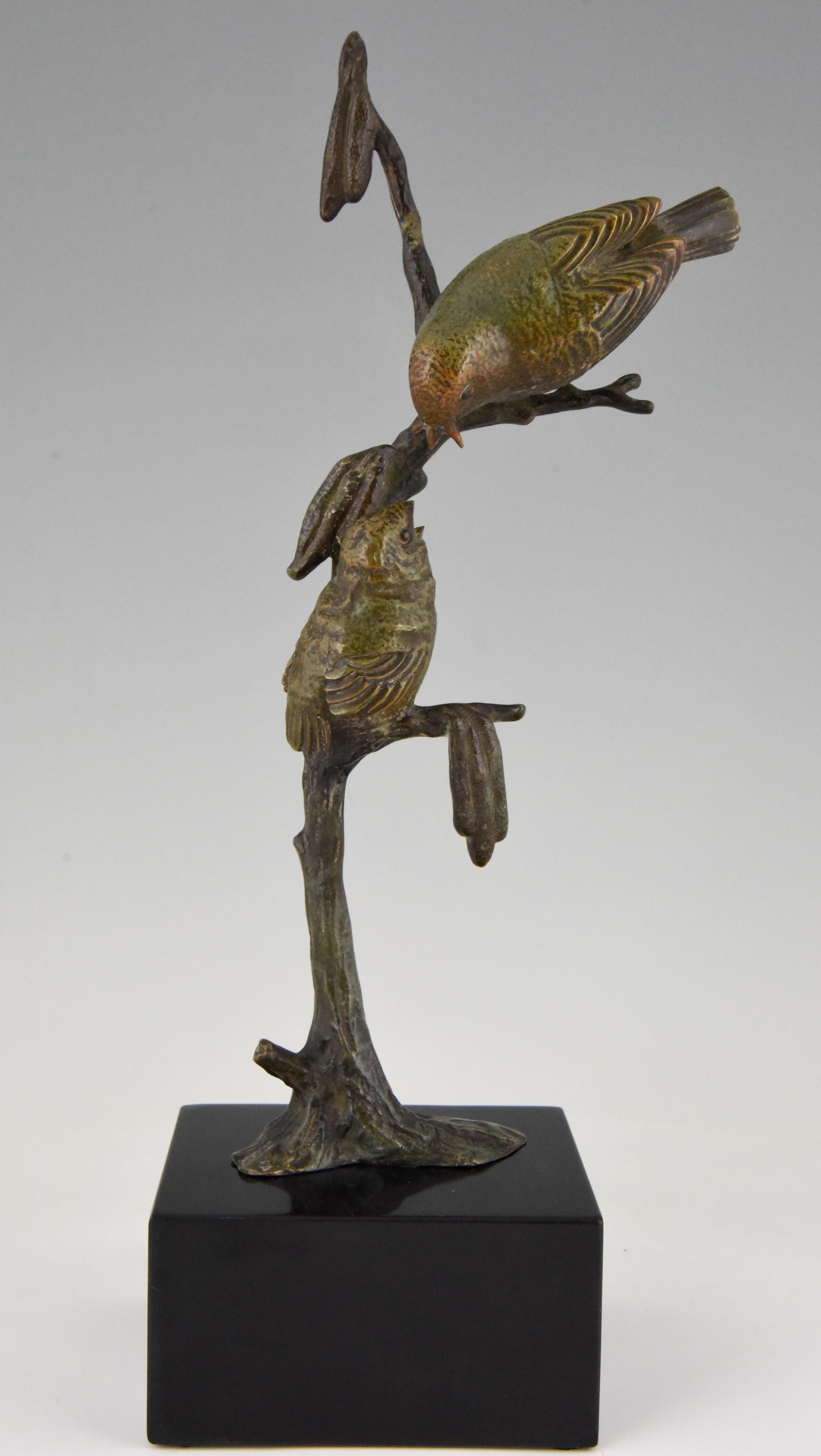 Cute Art Deco bronze sculpture of a two birds on a branch.
The bronze is signed by the French artist Irenee Rochard, has a lovely patina and stands on a Belgian black marble base, circa 1930. 

“Animals in bronze” by Christopher Payne. Antique