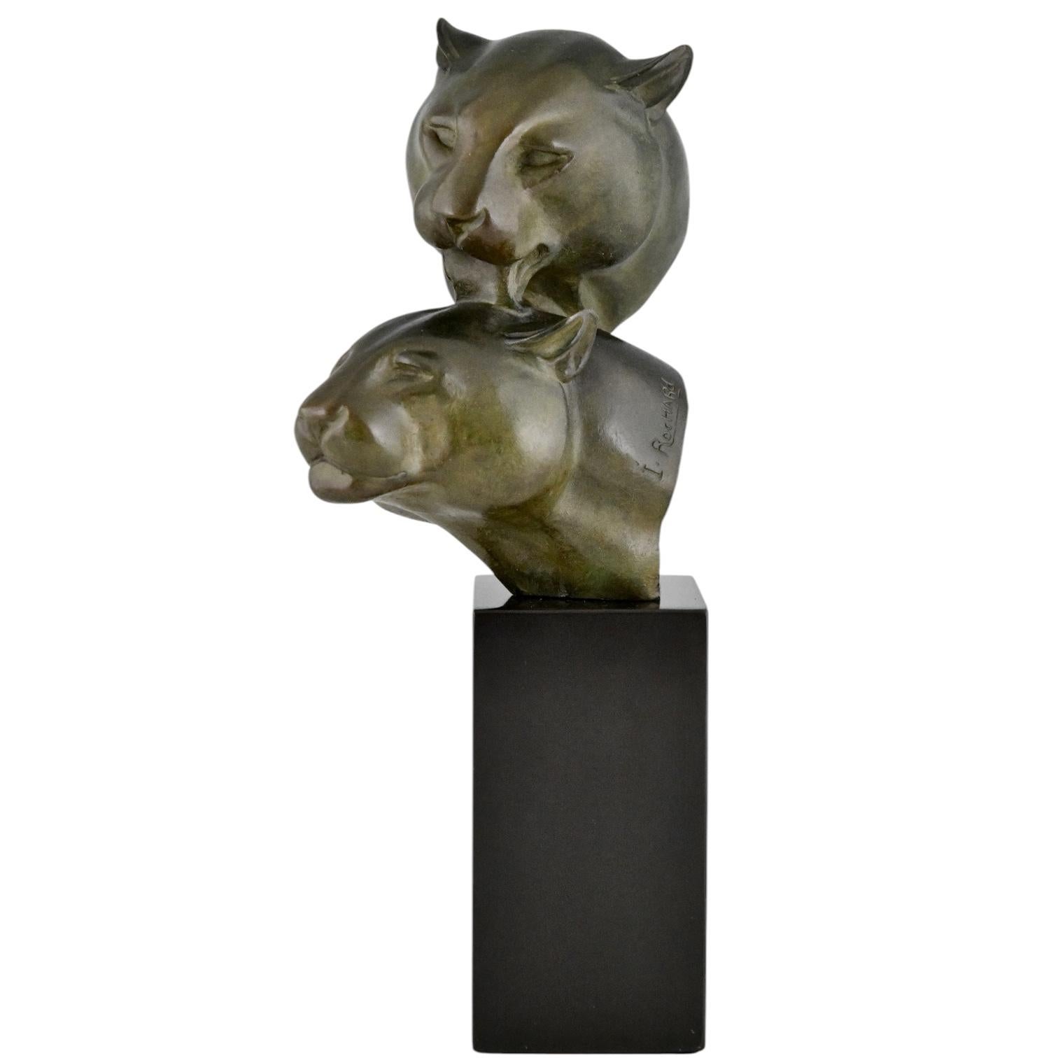 Art Deco bronze sculpture two panther heads by Irenee Rochard, France 1930. Bust of two panthers.
The bronze has a green patina and stands on a Belgian Black marble base.

Literature:
Animals in bronze by Christopher Payne. Antique collectors