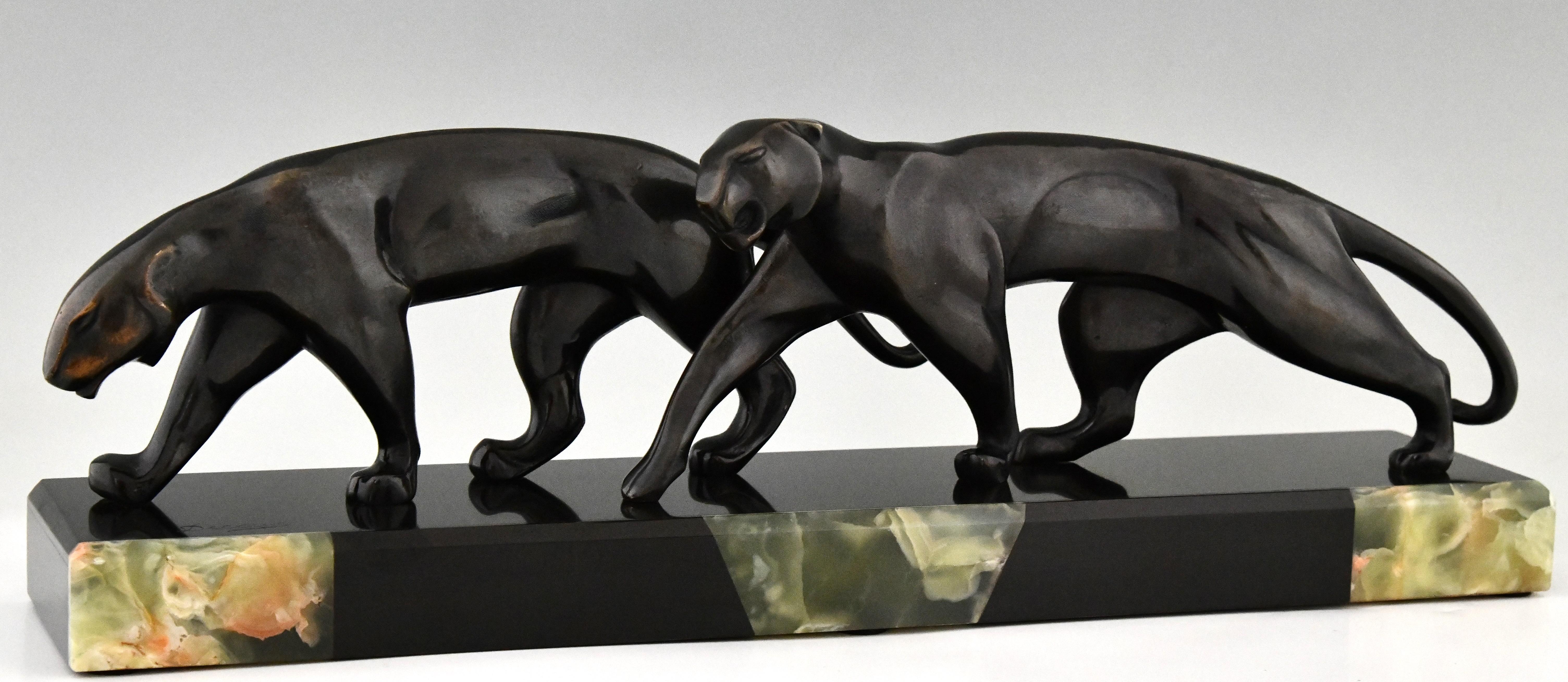 Bronzeskulptur zweier Panther im Art déco-Stil, signiert von Michel Decoux 1920 (Französisch) im Angebot