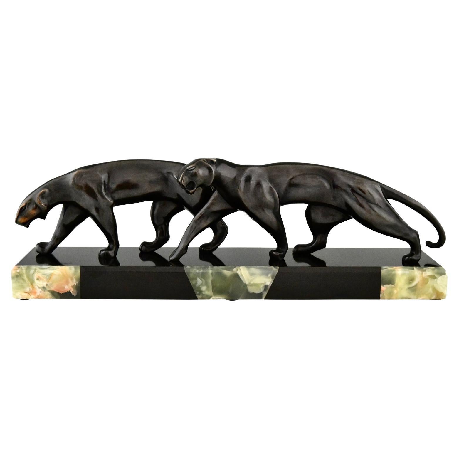 Bronzeskulptur zweier Panther im Art déco-Stil, signiert von Michel Decoux 1920