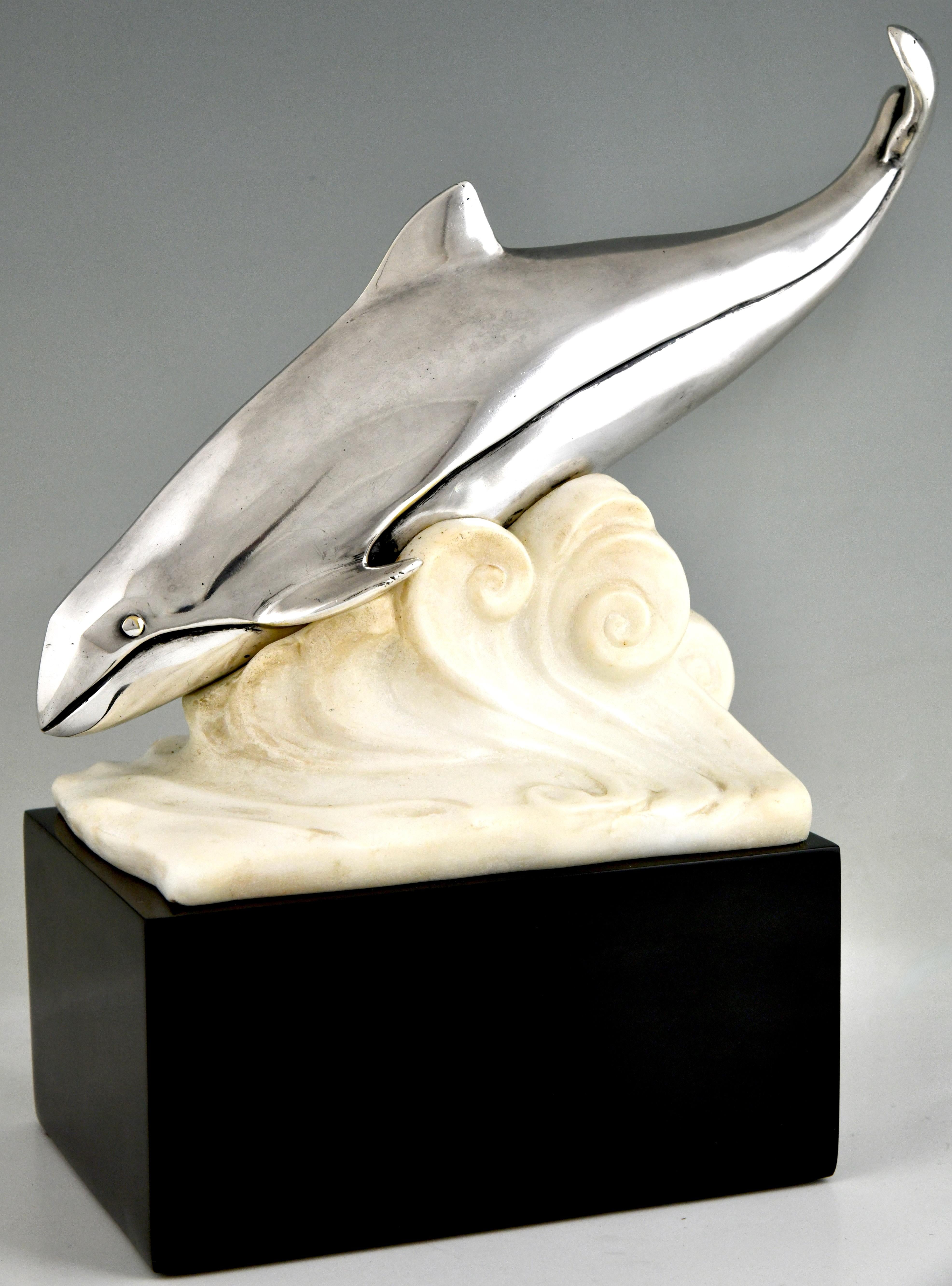 Art Deco bronze sculpture whale in the waves by Marcel André Bouraine
Bronze with silver patine, alabaster waves, on a Belgian Black marble base. 
France 1925. 
Very hard to find model by Bouraine. 

Literature on the artist:
Art Deco, Eric