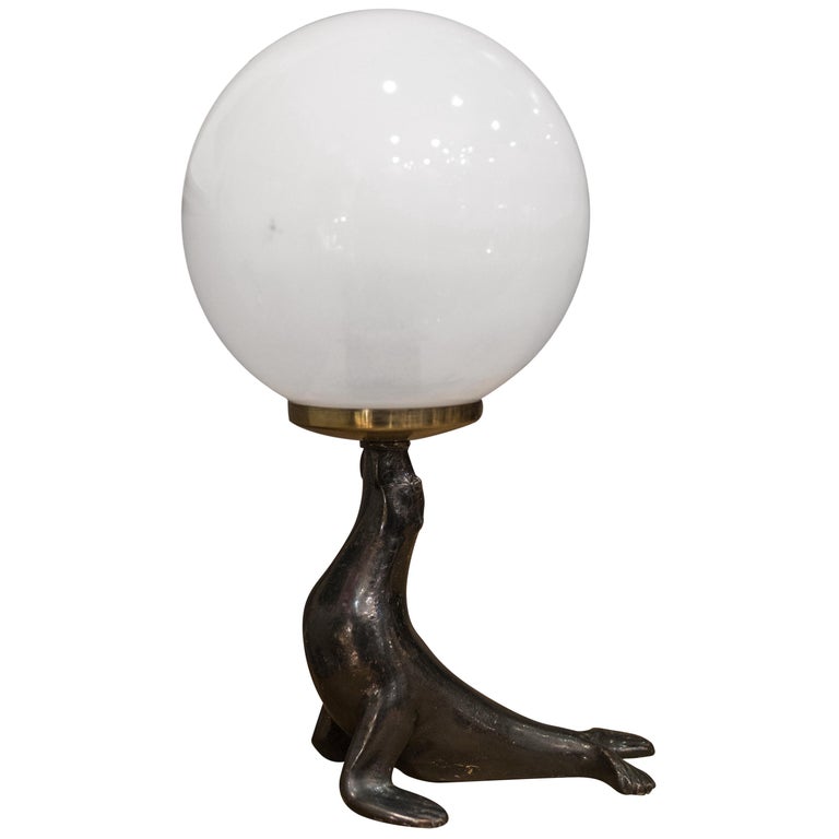 Art Deco Bronze Seal Figure and Glass Globe Table Lamp at 1stDibs
