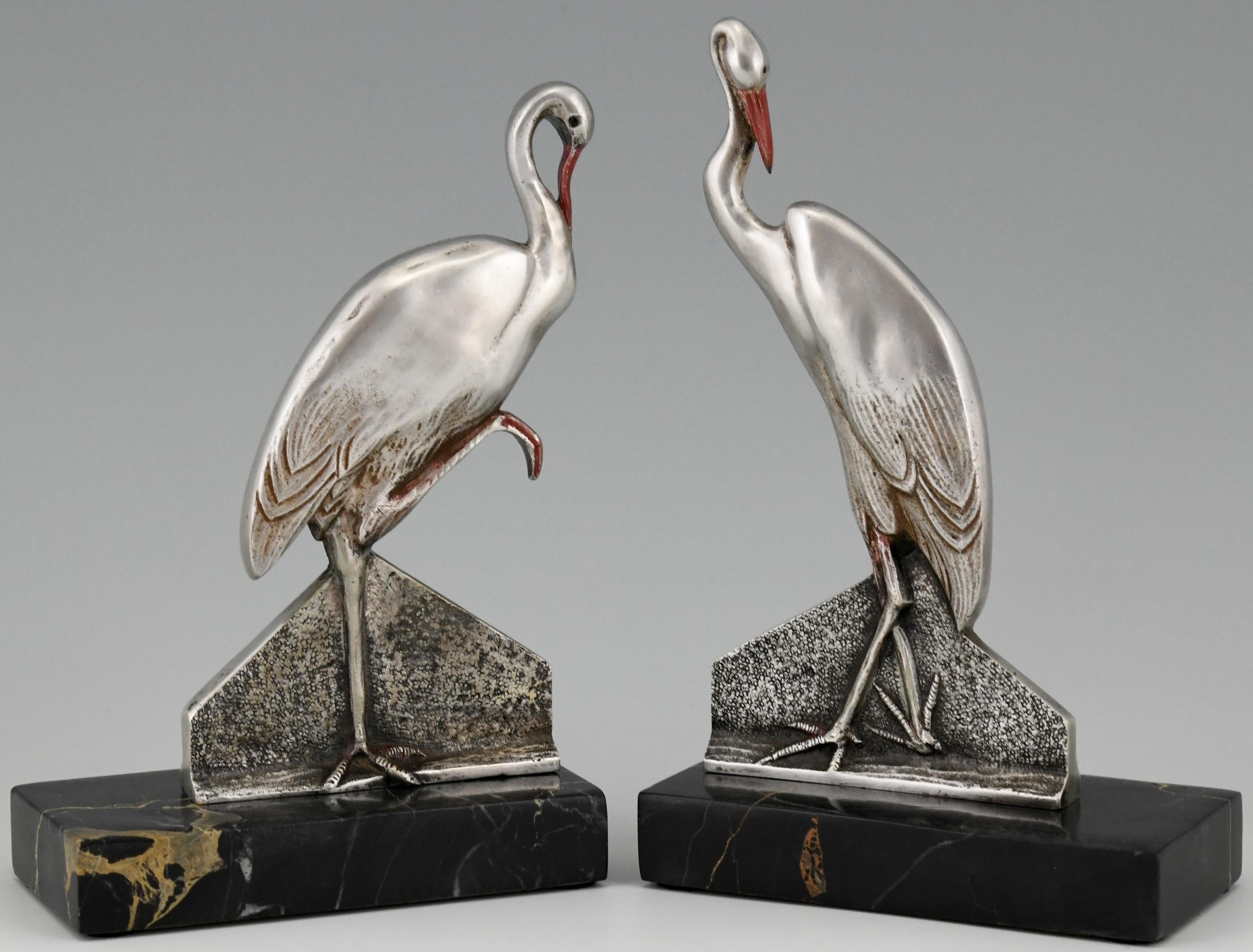 Lovely pair of Art Deco bronze bookends with a couple of stork birds.
Signed by F. H. Danvin, France, 1930. The bronze birds have a silver and red patina and are mounted on Portor marble bases.
Literature:
“Dictionnaire illustré des sculpteurs