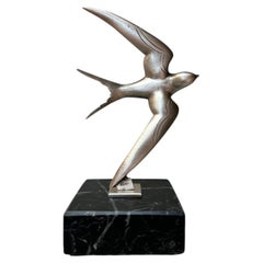 Scultura Art Déco in bronzo raffigurante una rondine, opera di G. Garreau