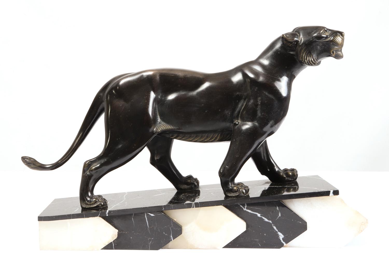 Art Deco bronze tiger by Irene Rochard, circa 1920.
A lovely example of a tiger produced in bronze and the black patinated, standing on marble and Onyx base, in very good condition throughout with age related wear, some scratches and marks to base-