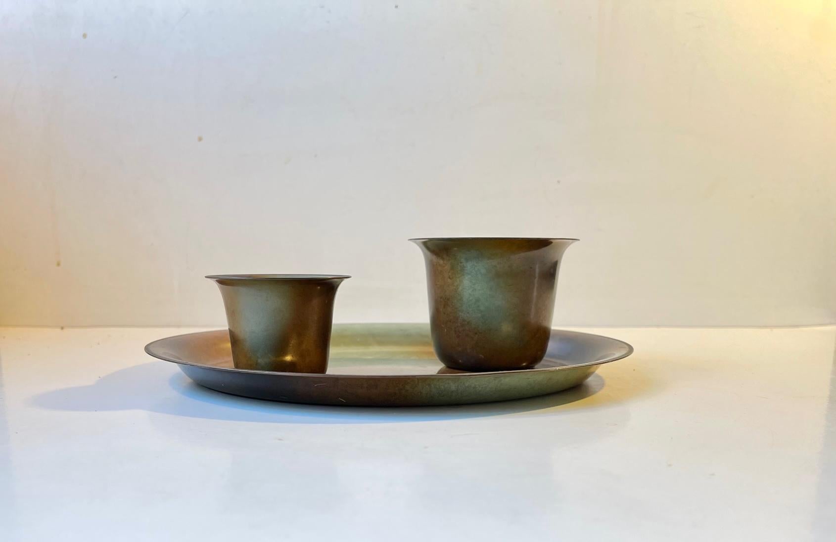 A set of 3 bronze pieces designed by Bernhard Linder and manufactured by Metalkonst in Sweden during the 1930s. Technique verdigris (artificial patina) treated bronze. Fully marked to the backside. Measurements: Vases: H: 7/5 cm, D: 9/6.5 cm.